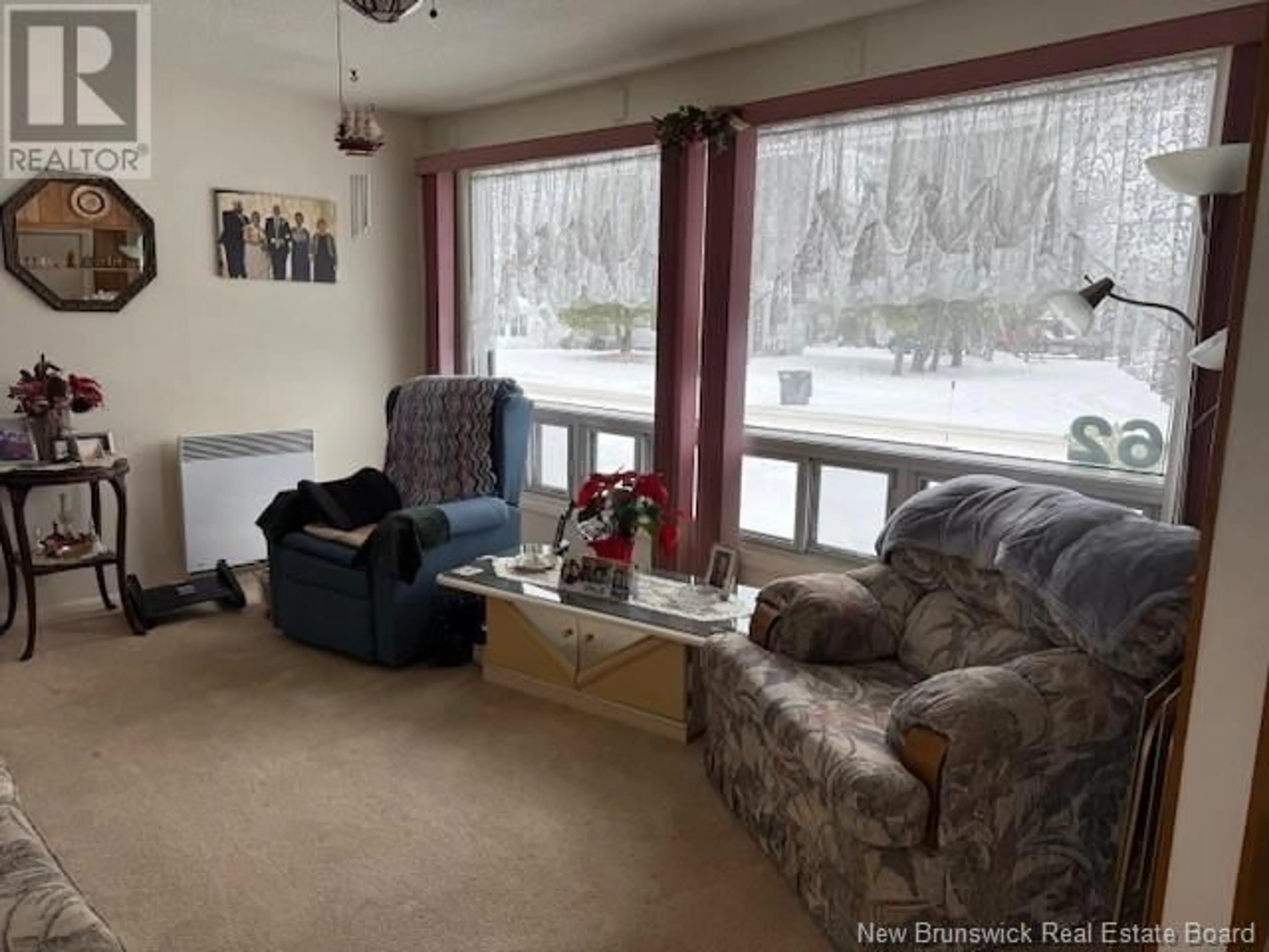 Living room with furniture, floor is not visible for 62 McIntosh Street, Miramichi New Brunswick E1N2B3