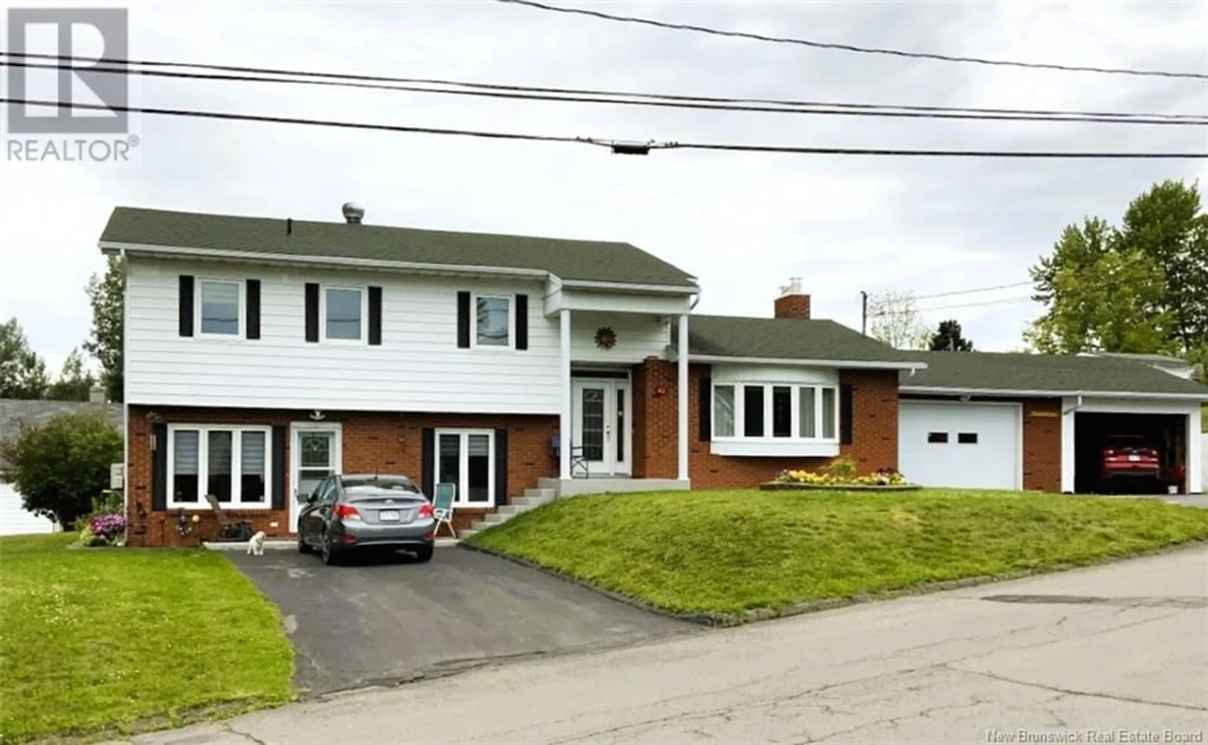 Home with brick exterior material, street for 42 J.-Gaspard-Boucher Avenue, Edmundston New Brunswick E3V1P5