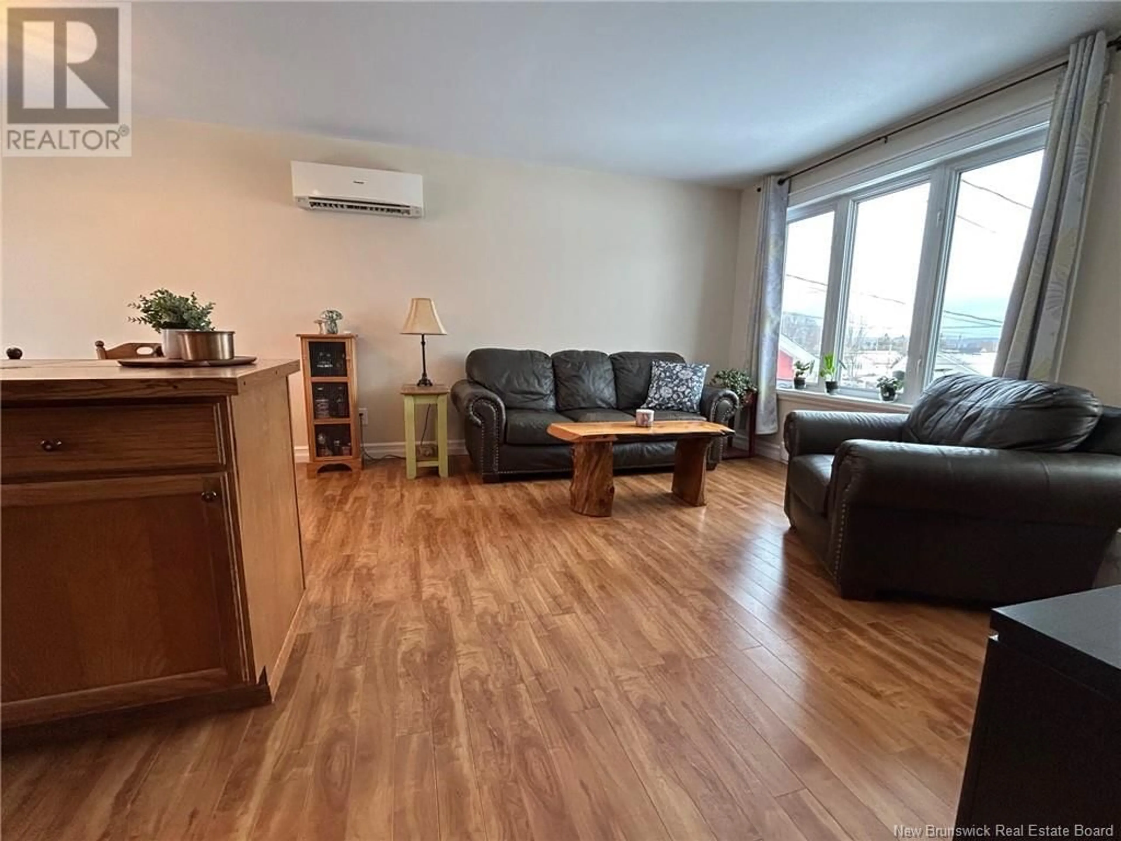 Living room with furniture, wood/laminate floor for 281 Milford Road, Saint John New Brunswick E2M4R5