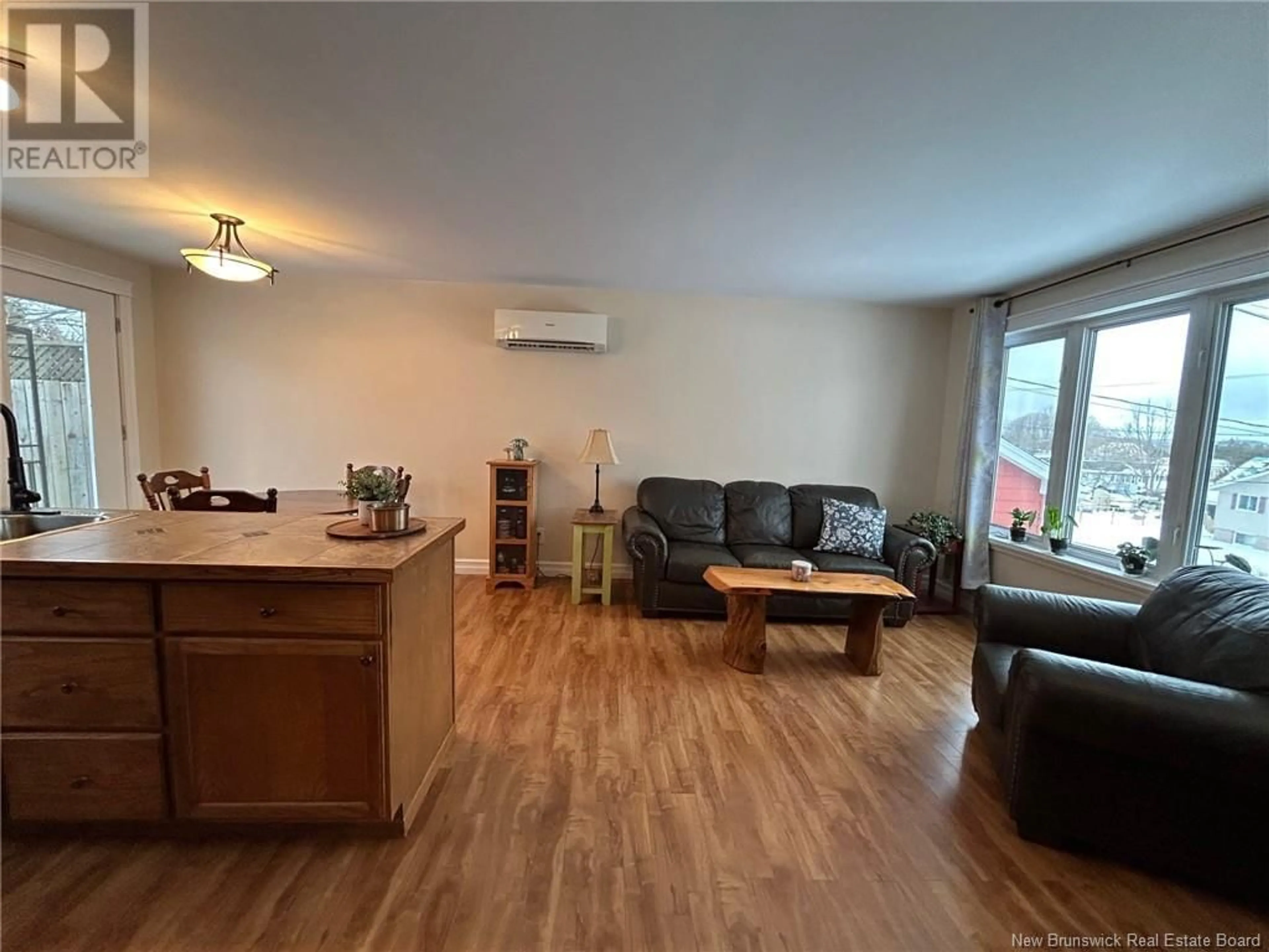 Living room with furniture, wood/laminate floor for 281 Milford Road, Saint John New Brunswick E2M4R5