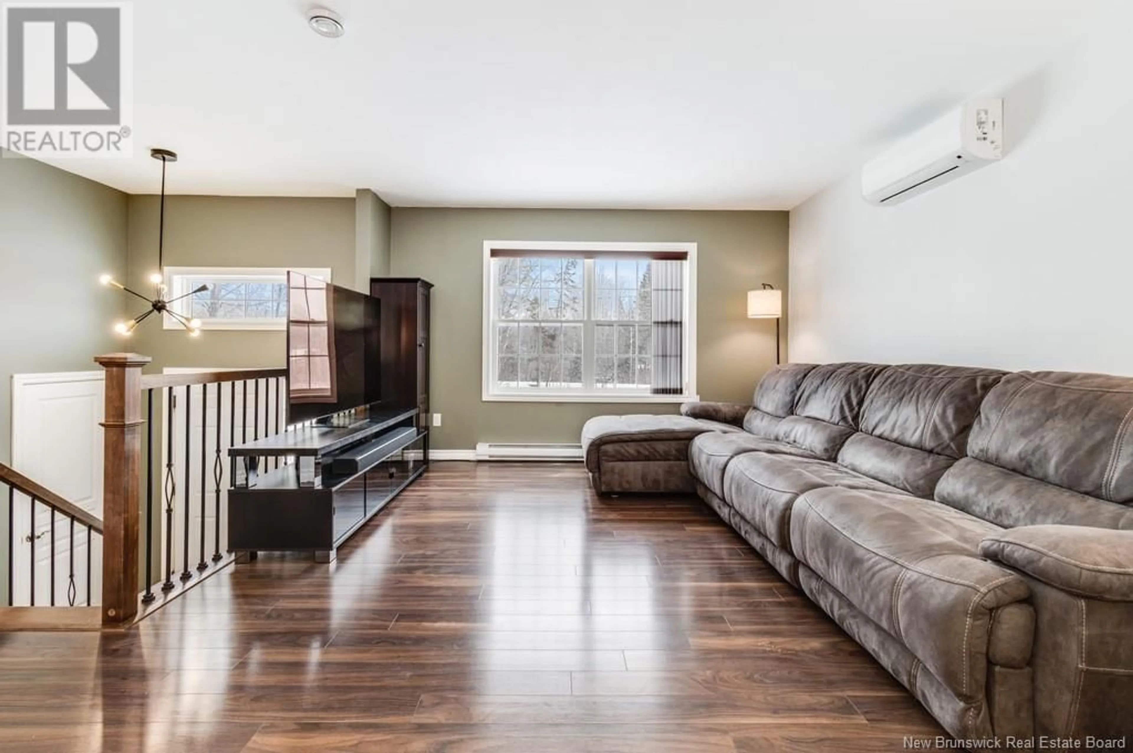 Living room with furniture, wood/laminate floor for 11 Beaumont Hamel Drive, Rusagonis New Brunswick E3B0W9