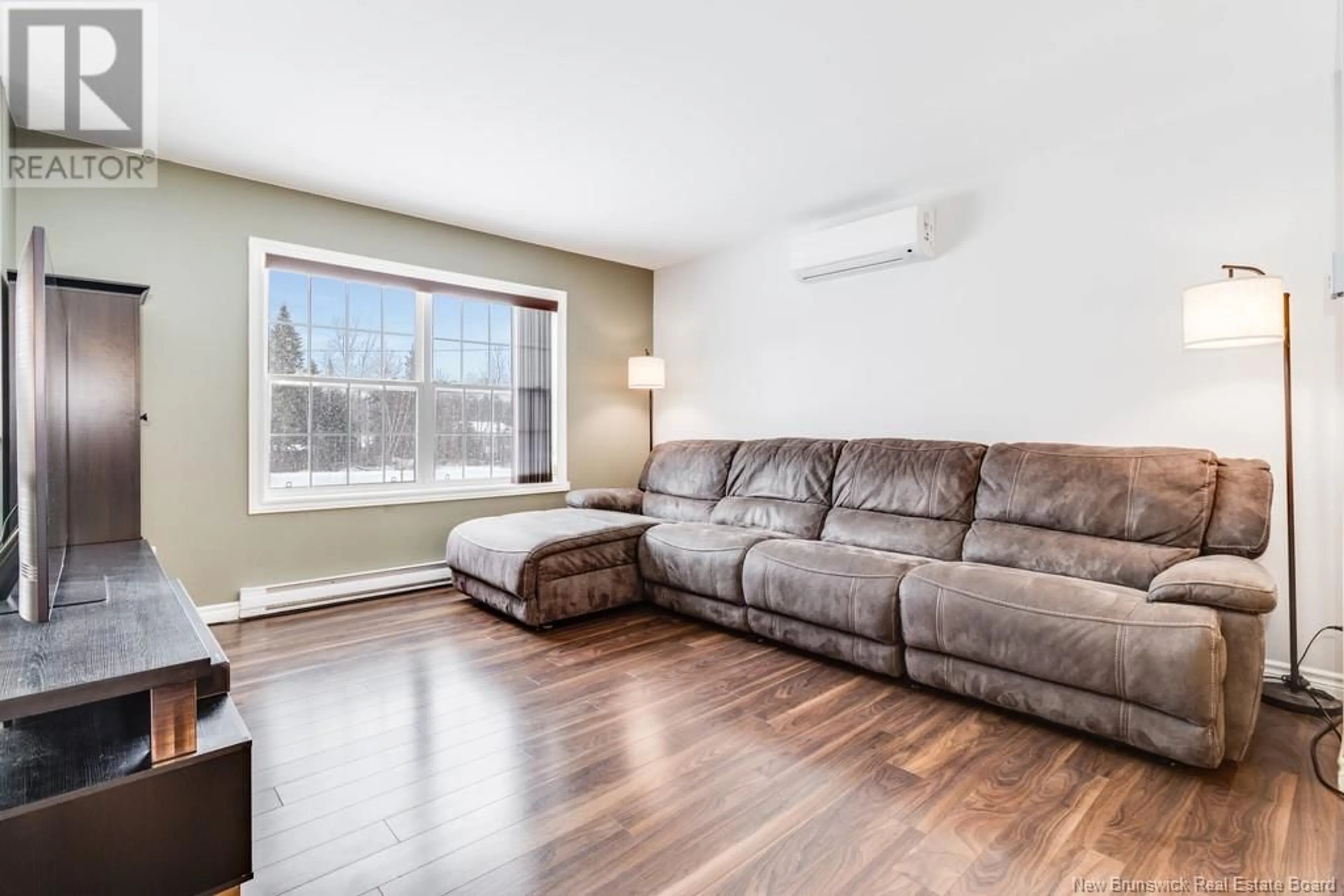 Living room with furniture, wood/laminate floor for 11 Beaumont Hamel Drive, Rusagonis New Brunswick E3B0W9