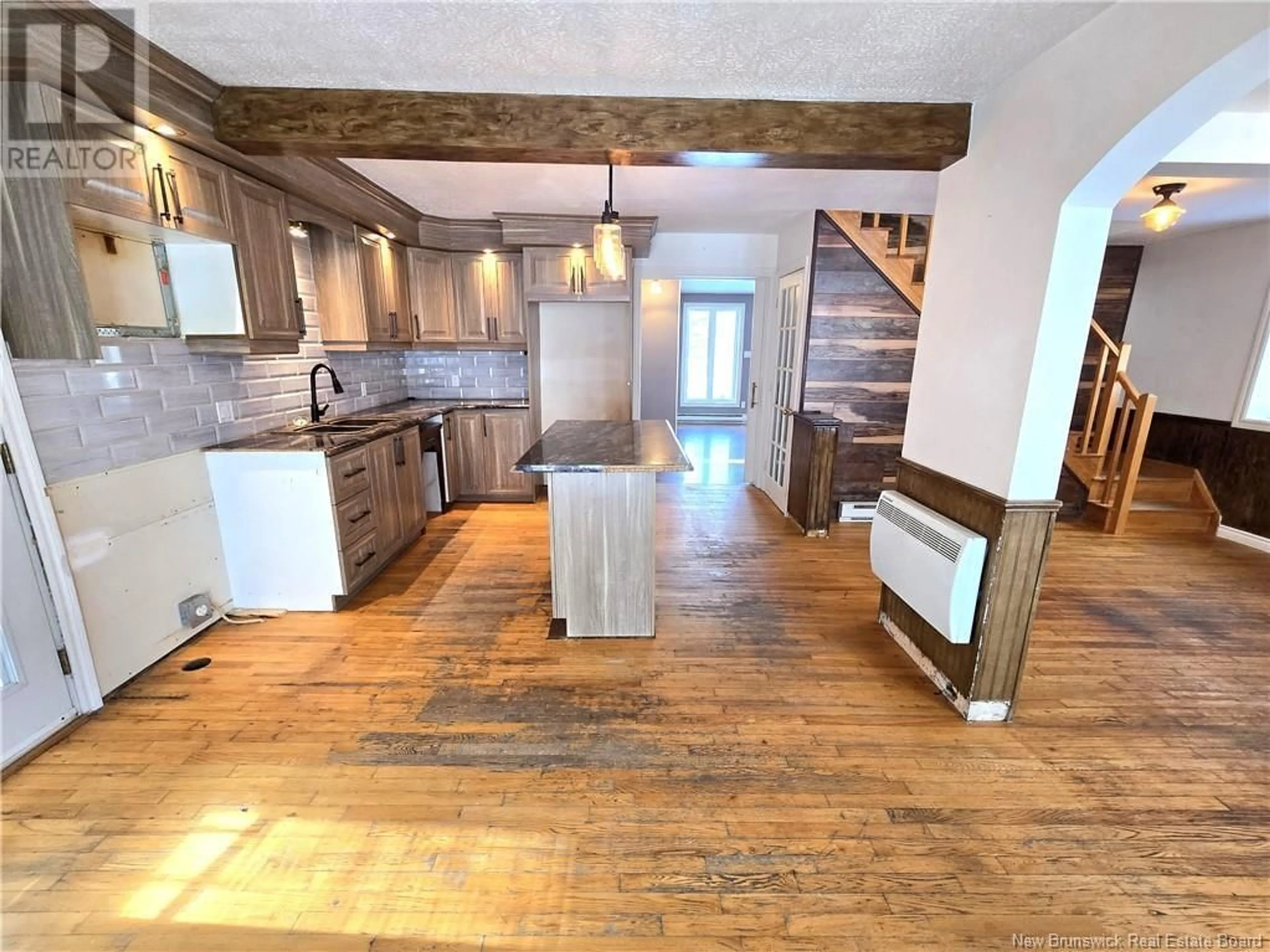 Open concept kitchen, wood/laminate floor for 13850 144 Route, Rivière-Verte New Brunswick E7C3B6