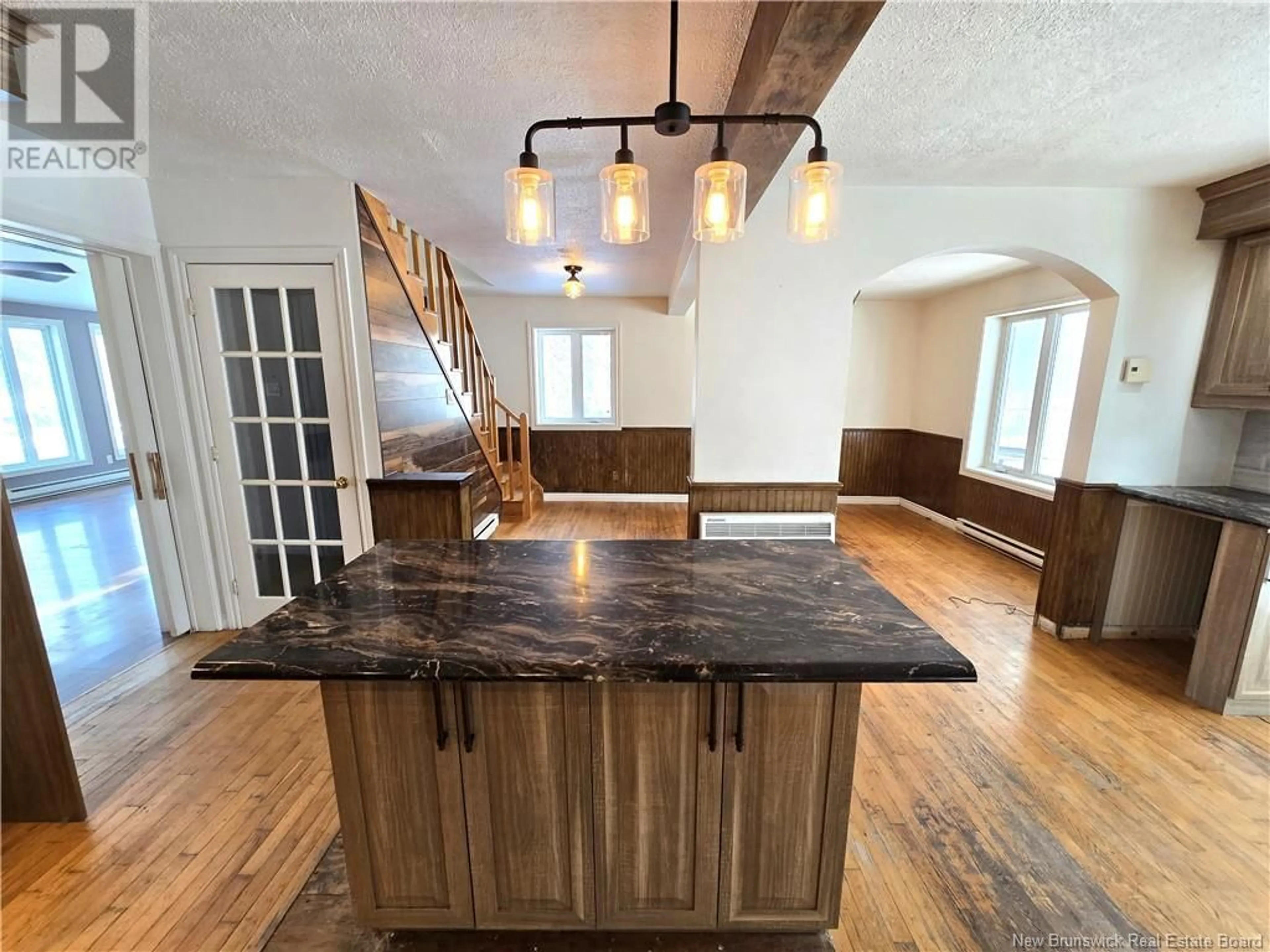 Open concept kitchen, wood/laminate floor for 13850 144 Route, Rivière-Verte New Brunswick E7C3B6