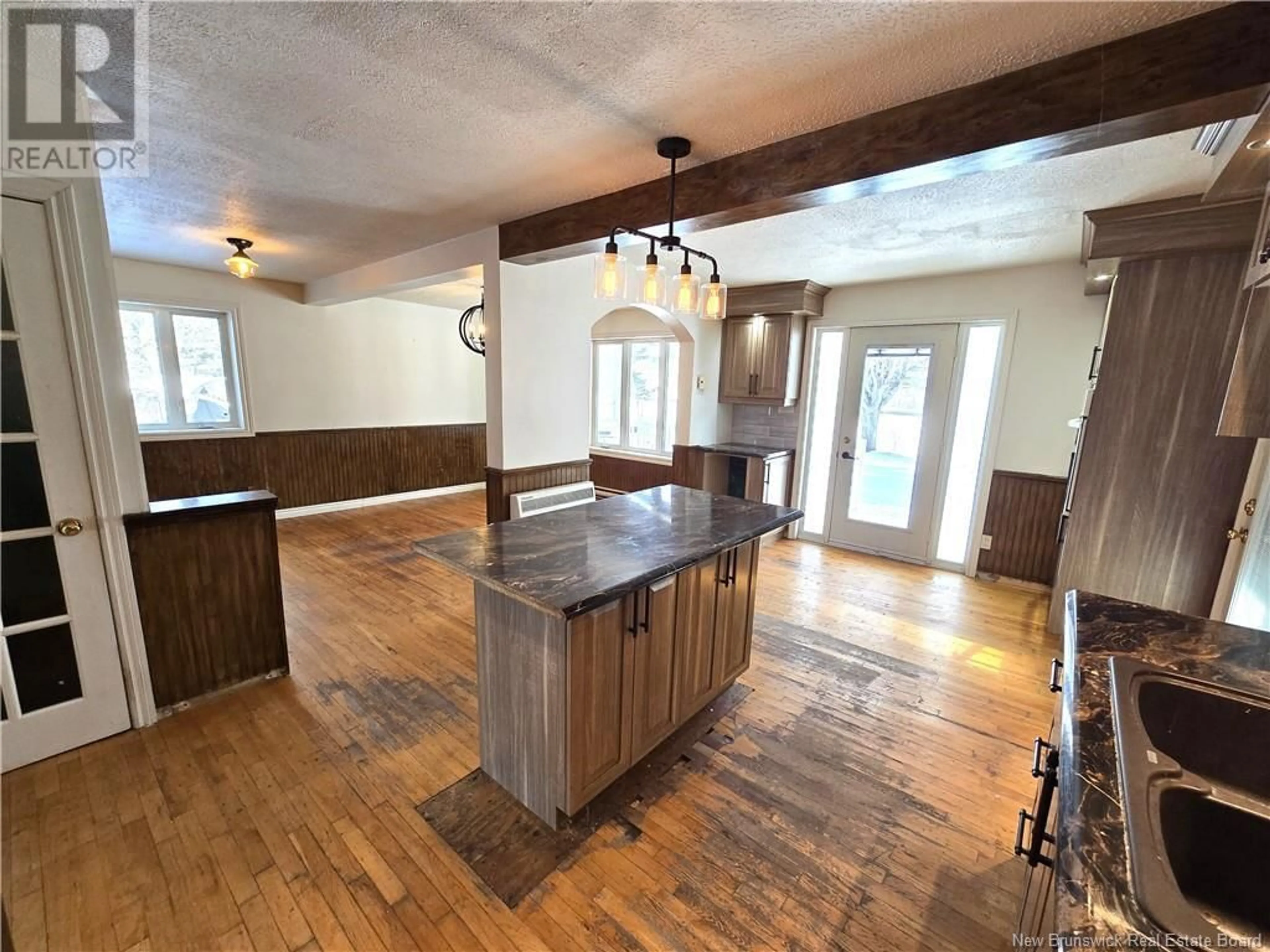 Open concept kitchen, wood/laminate floor for 13850 144 Route, Rivière-Verte New Brunswick E7C3B6