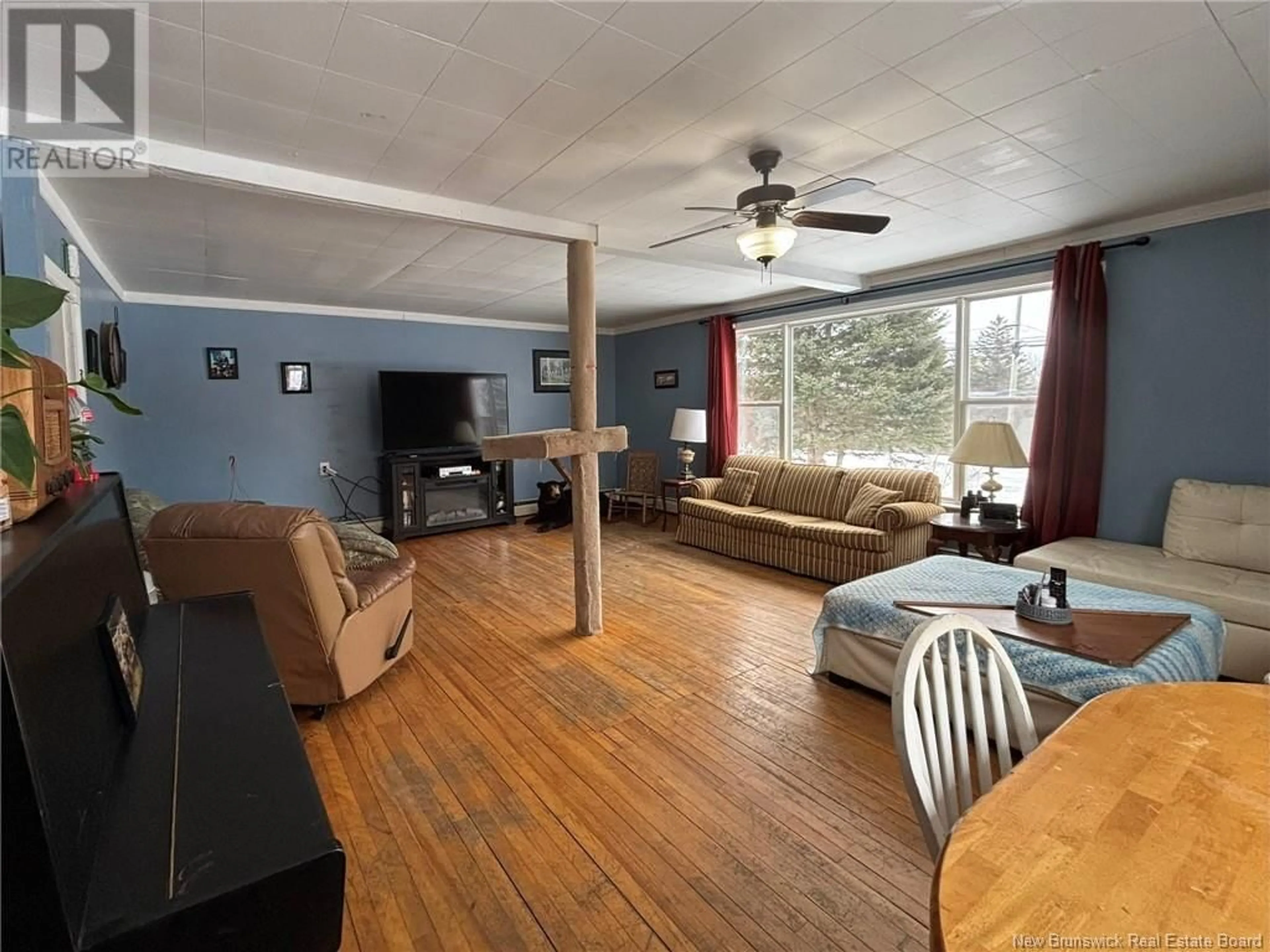 Living room with furniture, wood/laminate floor for 240 776 Route, Grand Manan New Brunswick E5G1A5