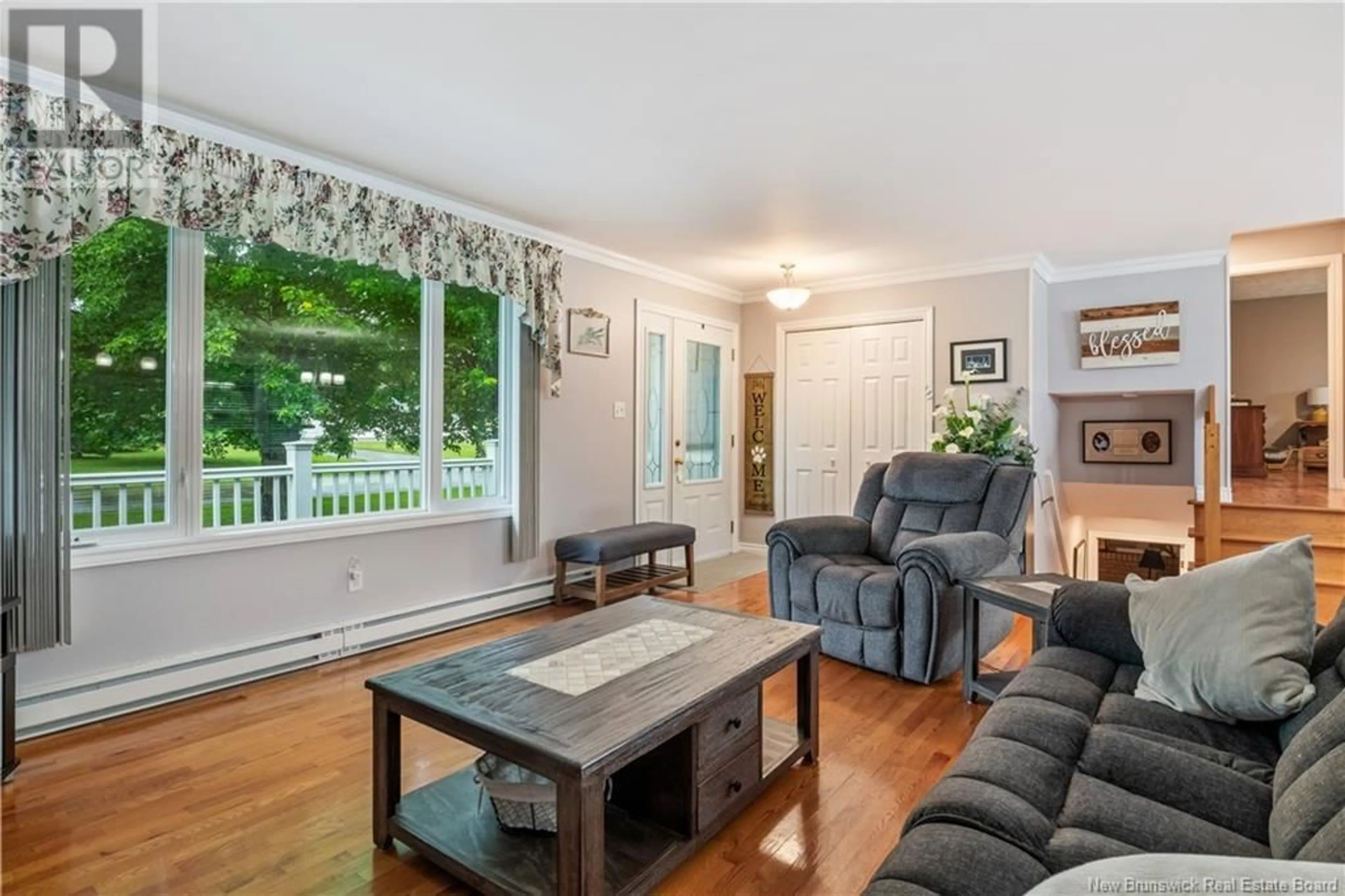 Living room with furniture, wood/laminate floor for 45 Yvon Street, Saint-Antoine New Brunswick E4V1K3