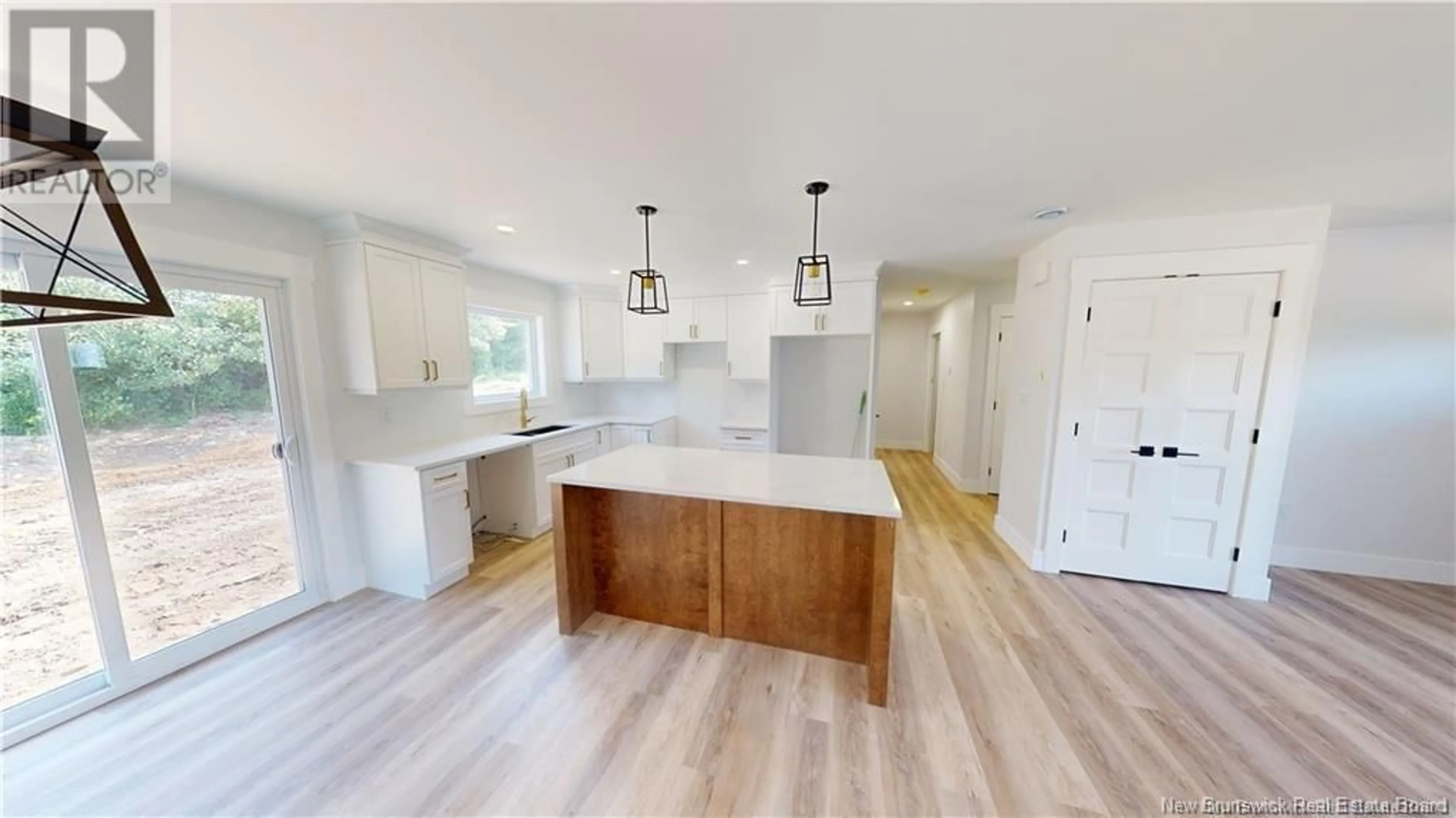 Open concept kitchen, wood/laminate floor for 1-2021 616 Route, Keswick Ridge New Brunswick E6L1T3