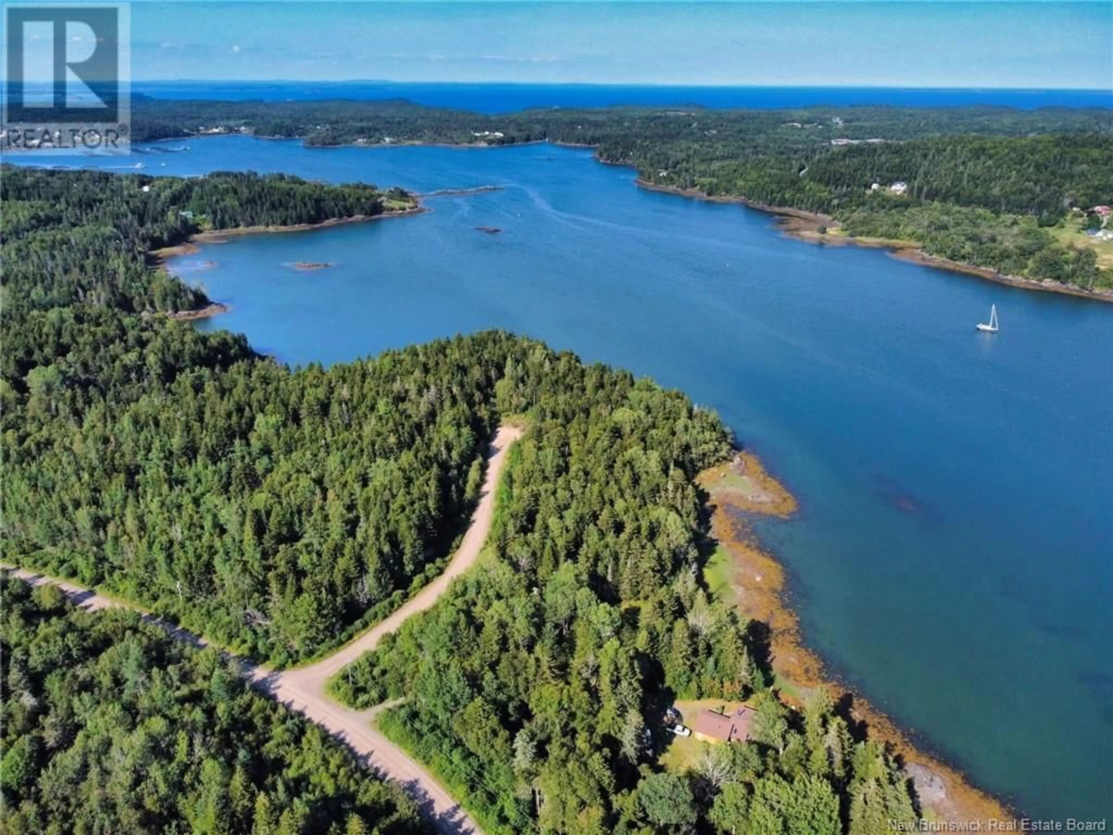 A pic from outside/outdoor area/front of a property/back of a property/a pic from drone, water/lake/river/ocean view for 61 CIRCLE DRIVE, Welshpool New Brunswick E5E1Z8