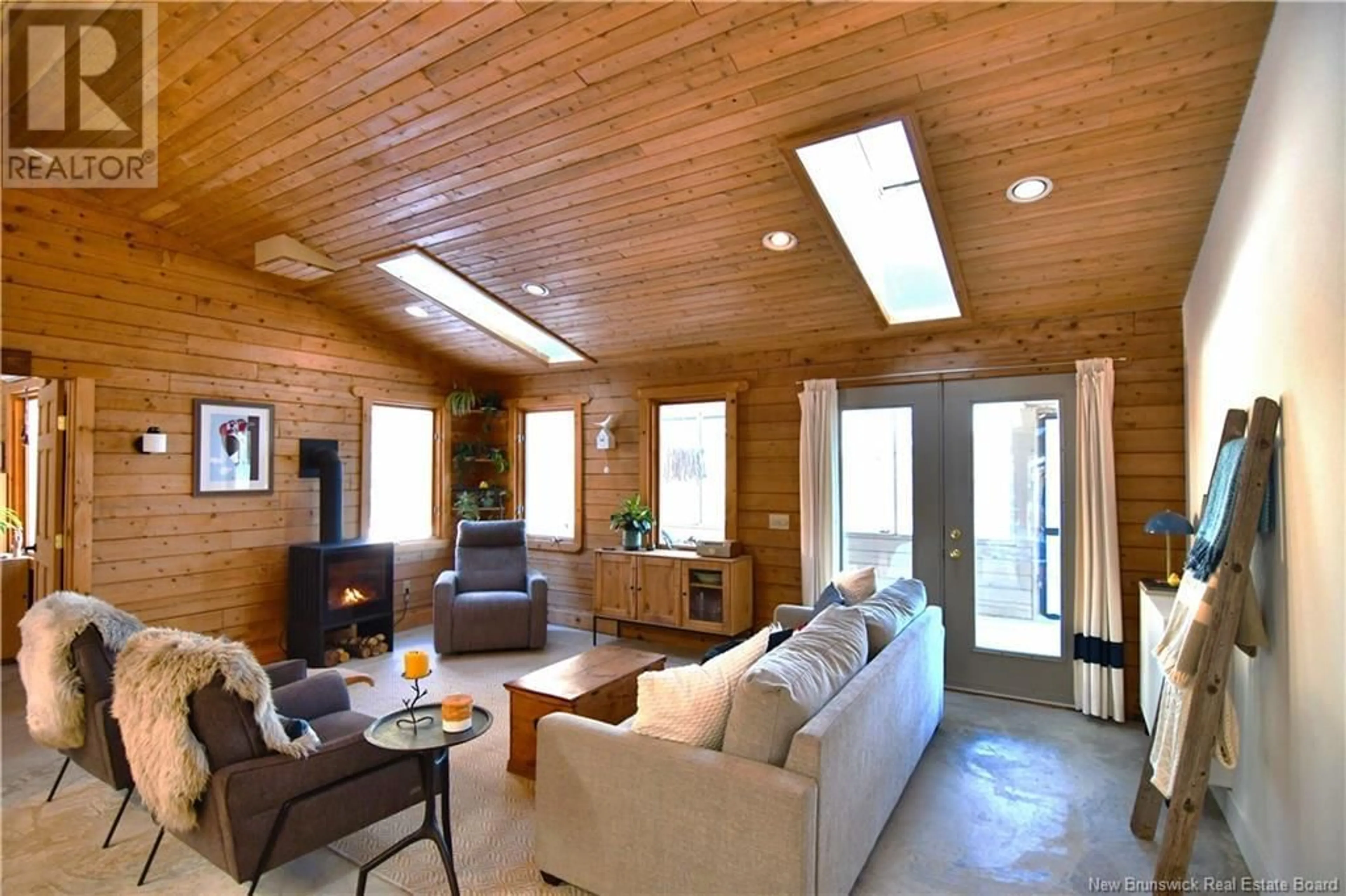 Living room with furniture, wood/laminate floor for 61 CIRCLE DRIVE, Welshpool New Brunswick E5E1Z8