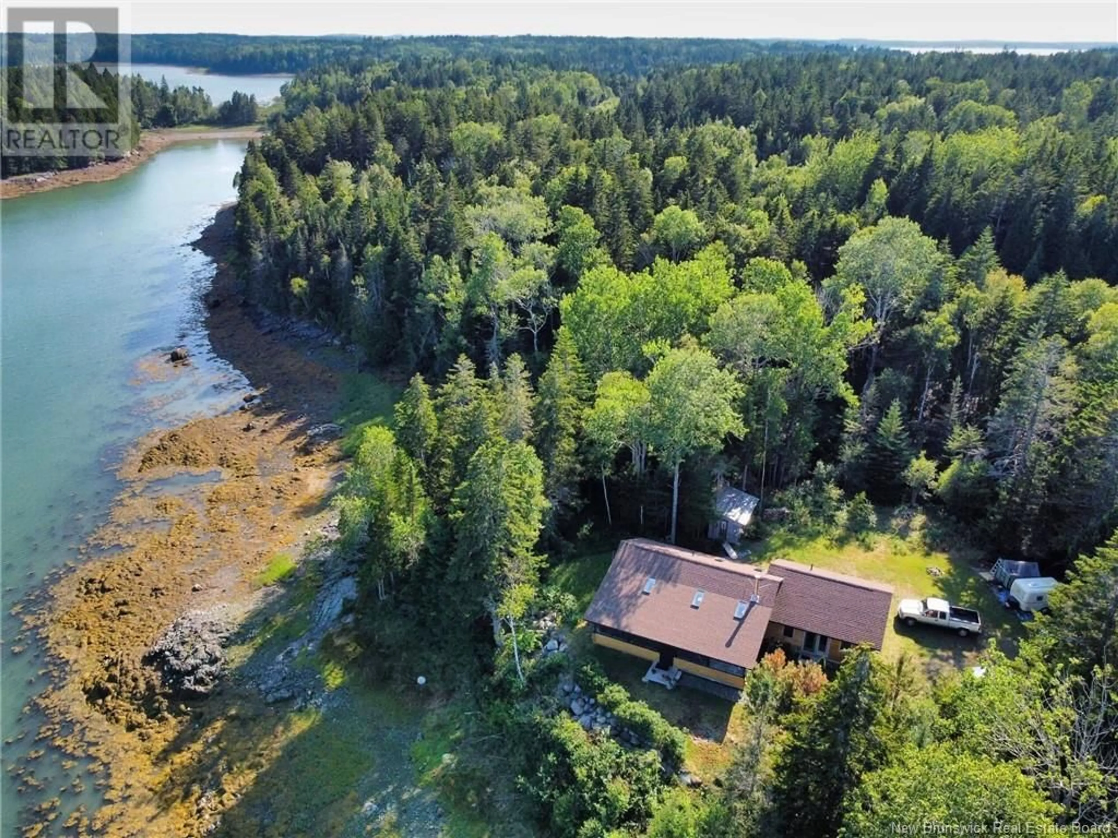 A pic from outside/outdoor area/front of a property/back of a property/a pic from drone, water/lake/river/ocean view for 61 Circle Drive, Welshpool New Brunswick E5E1Z8