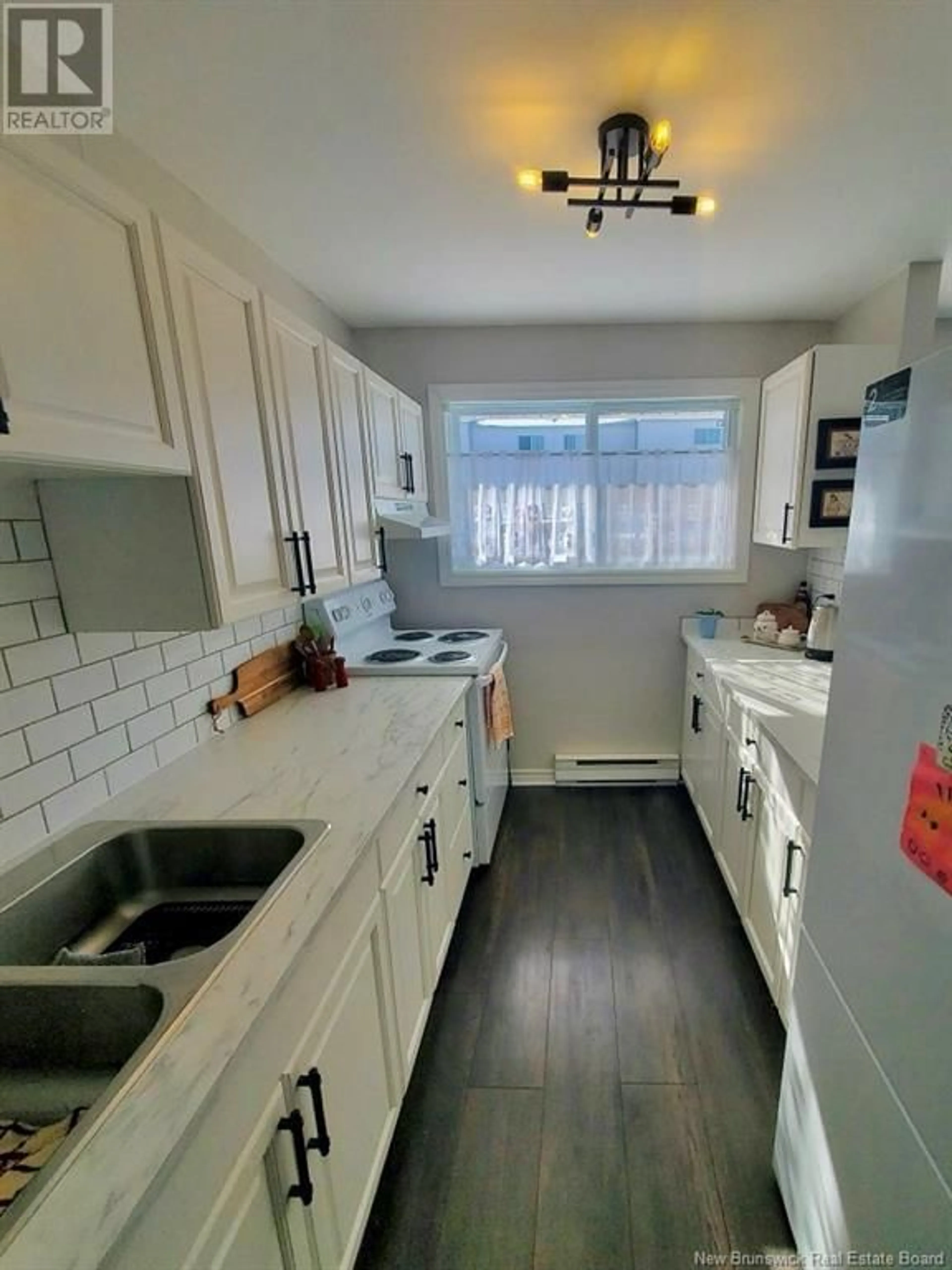 Open concept kitchen, ceramic/tile floor for 24 suffolk Street Unit# 11, Riverview New Brunswick E1B4X6