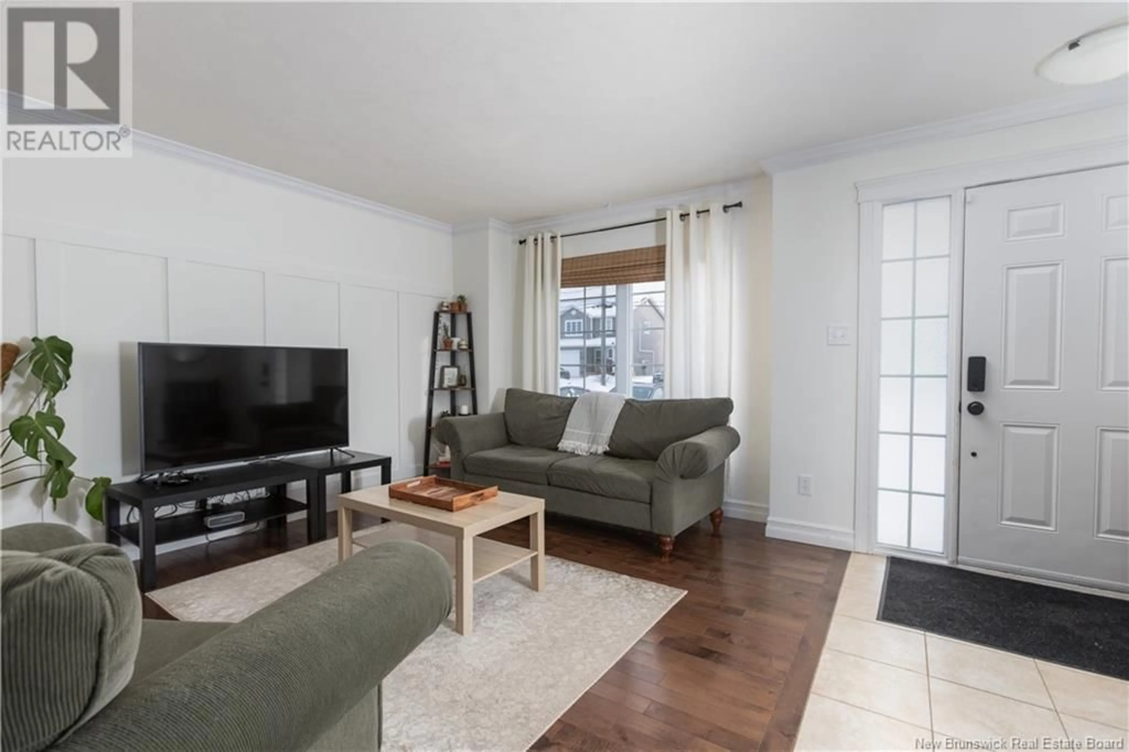 Living room with furniture, wood/laminate floor for 39 Oxiard Street, Dieppe New Brunswick E1A6A6