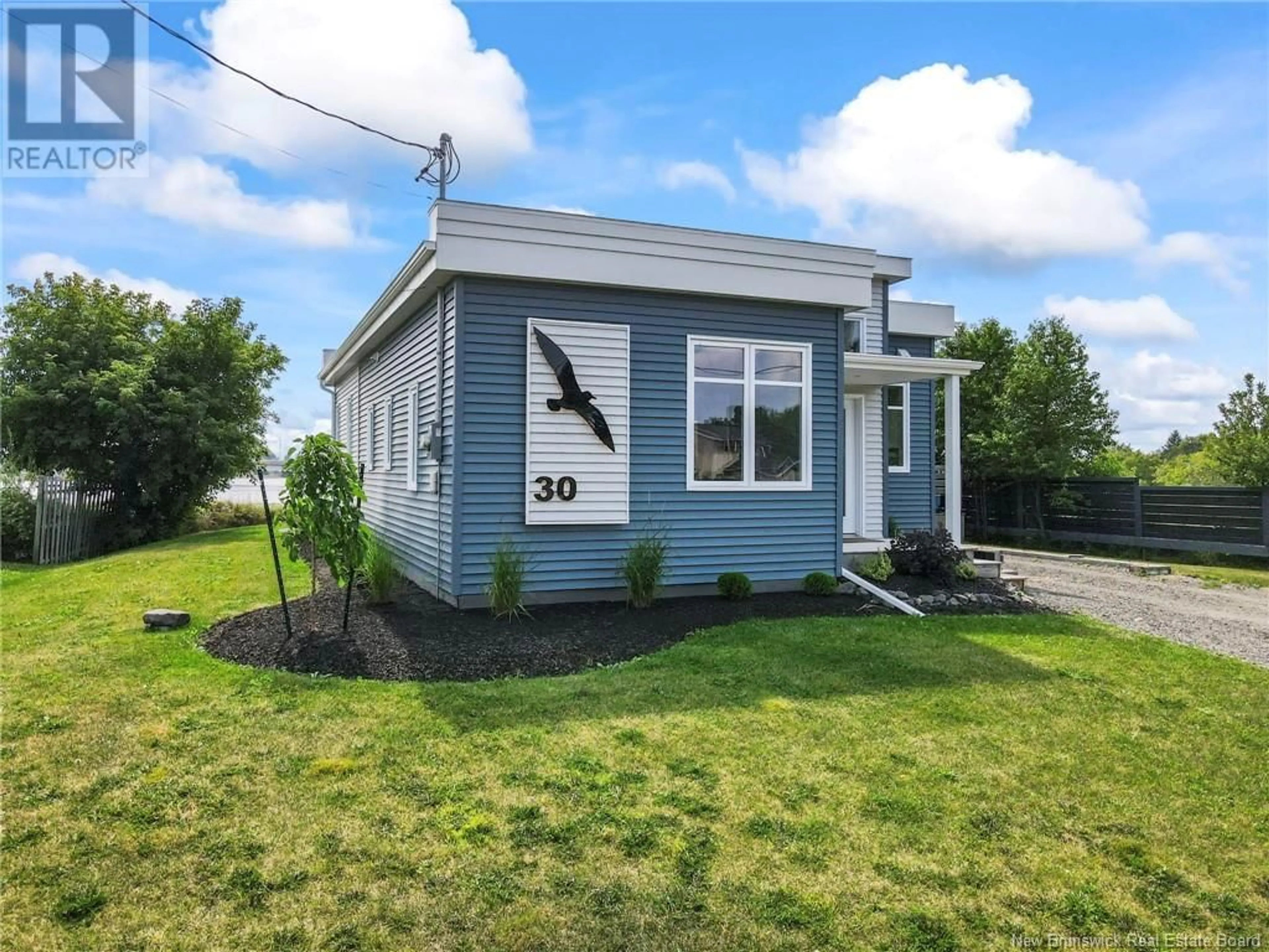 Home with vinyl exterior material, street for 30 Acadie Street, Cocagne New Brunswick E4R5Y6