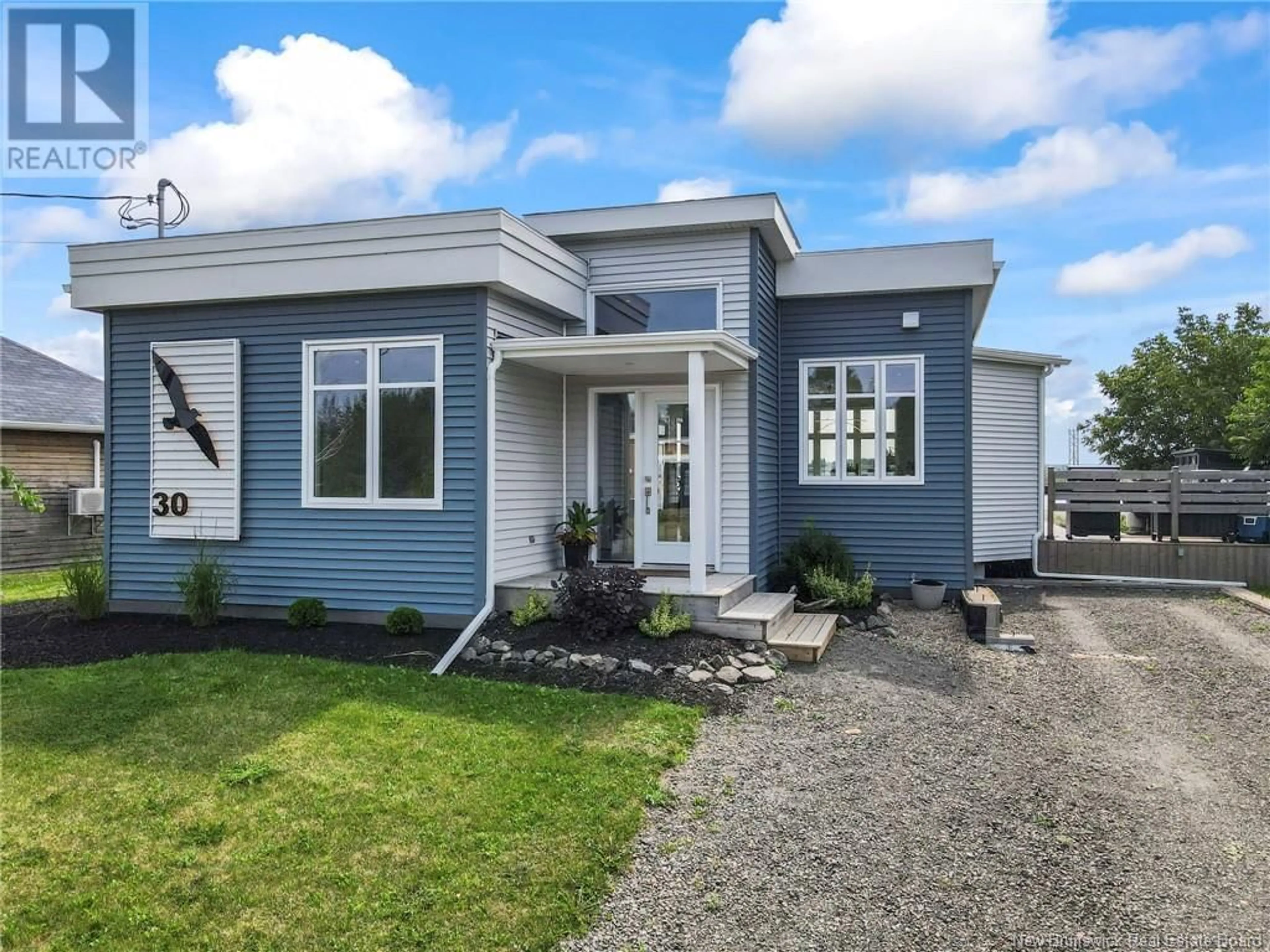 Home with vinyl exterior material, street for 30 Acadie Street, Cocagne New Brunswick E4R5Y6