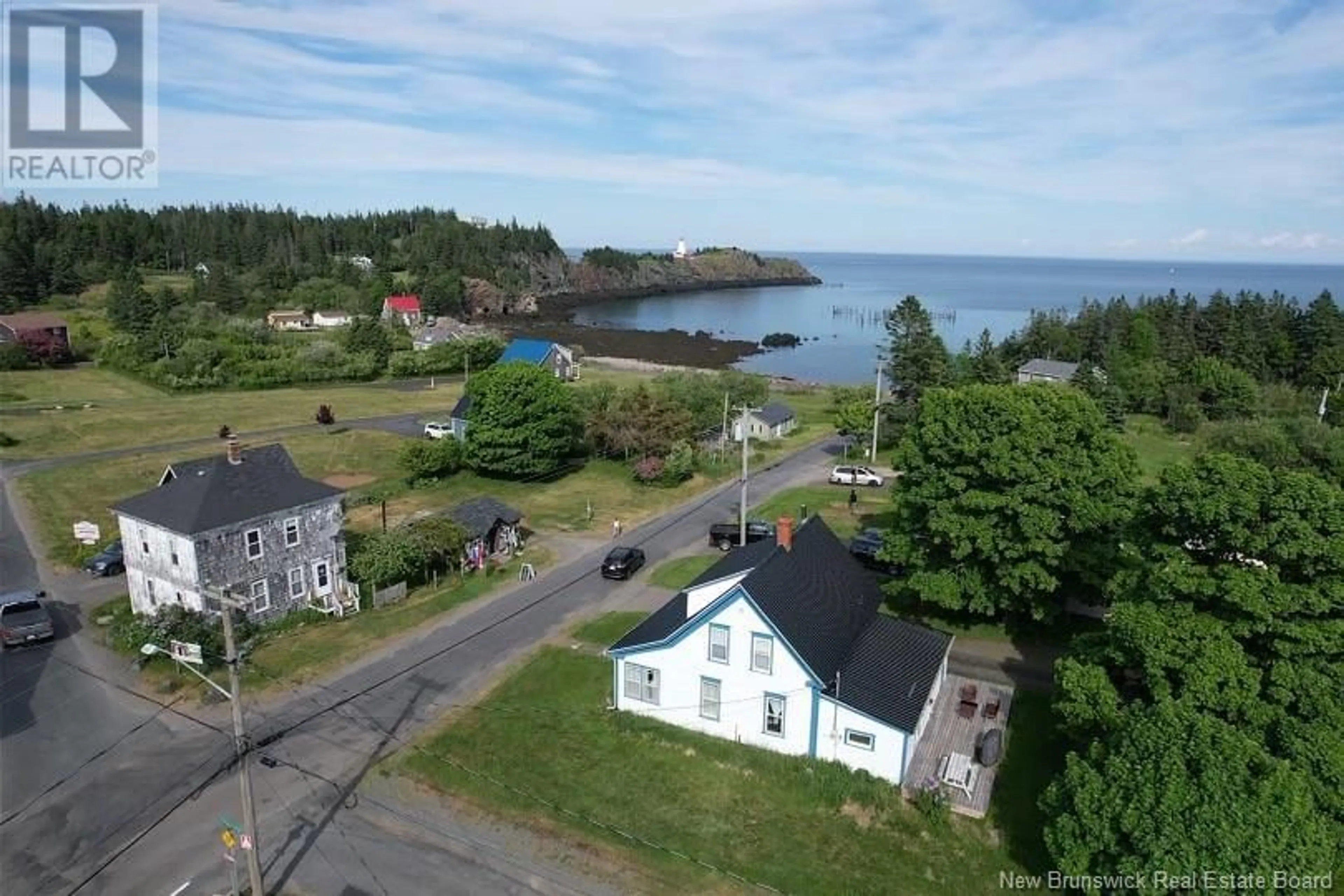 A pic from outside/outdoor area/front of a property/back of a property/a pic from drone, water/lake/river/ocean view for 12 Pettes Cove Road, Grand Manan New Brunswick E5G1A7