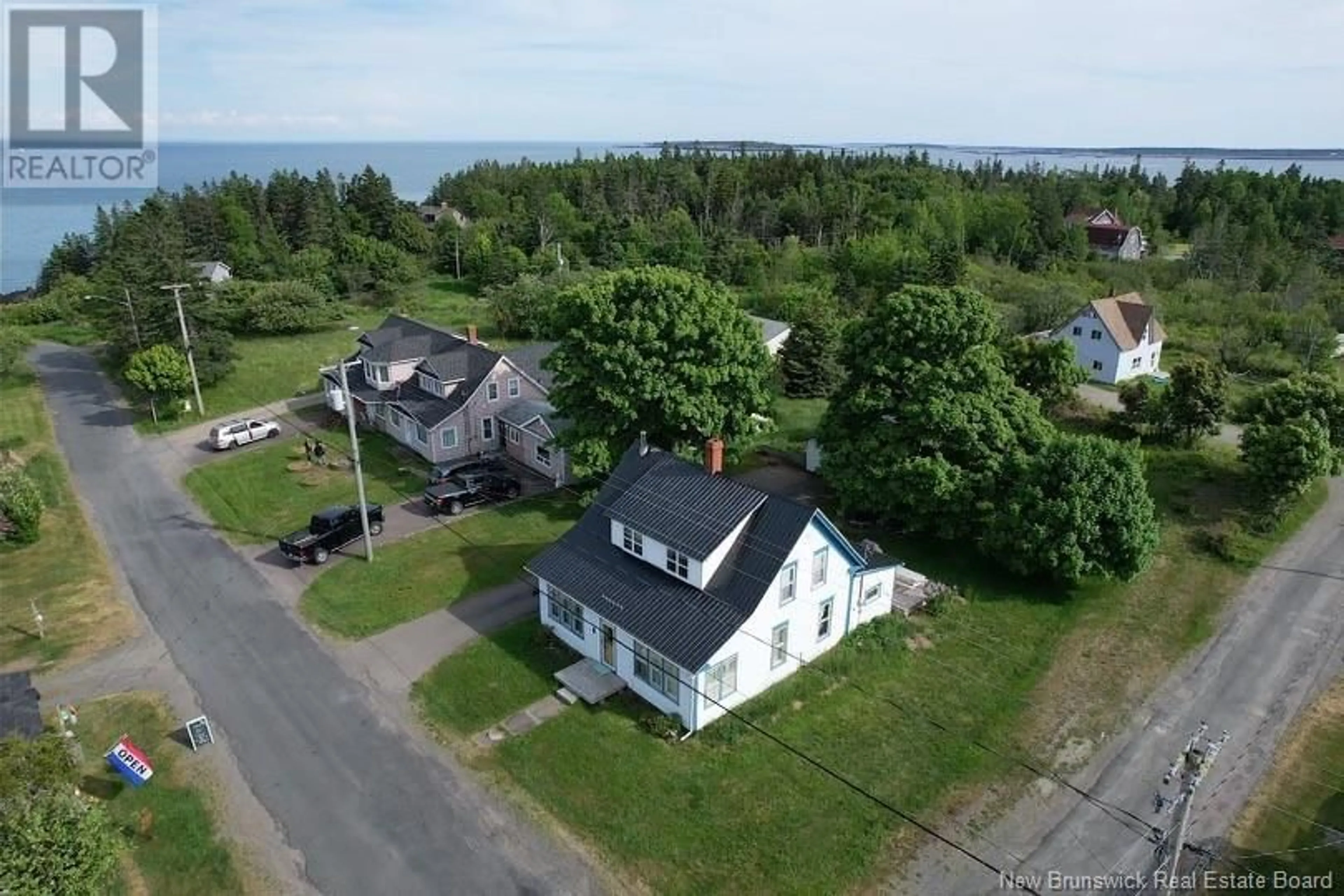 A pic from outside/outdoor area/front of a property/back of a property/a pic from drone, water/lake/river/ocean view for 12 Pettes Cove Road, Grand Manan New Brunswick E5G1A7