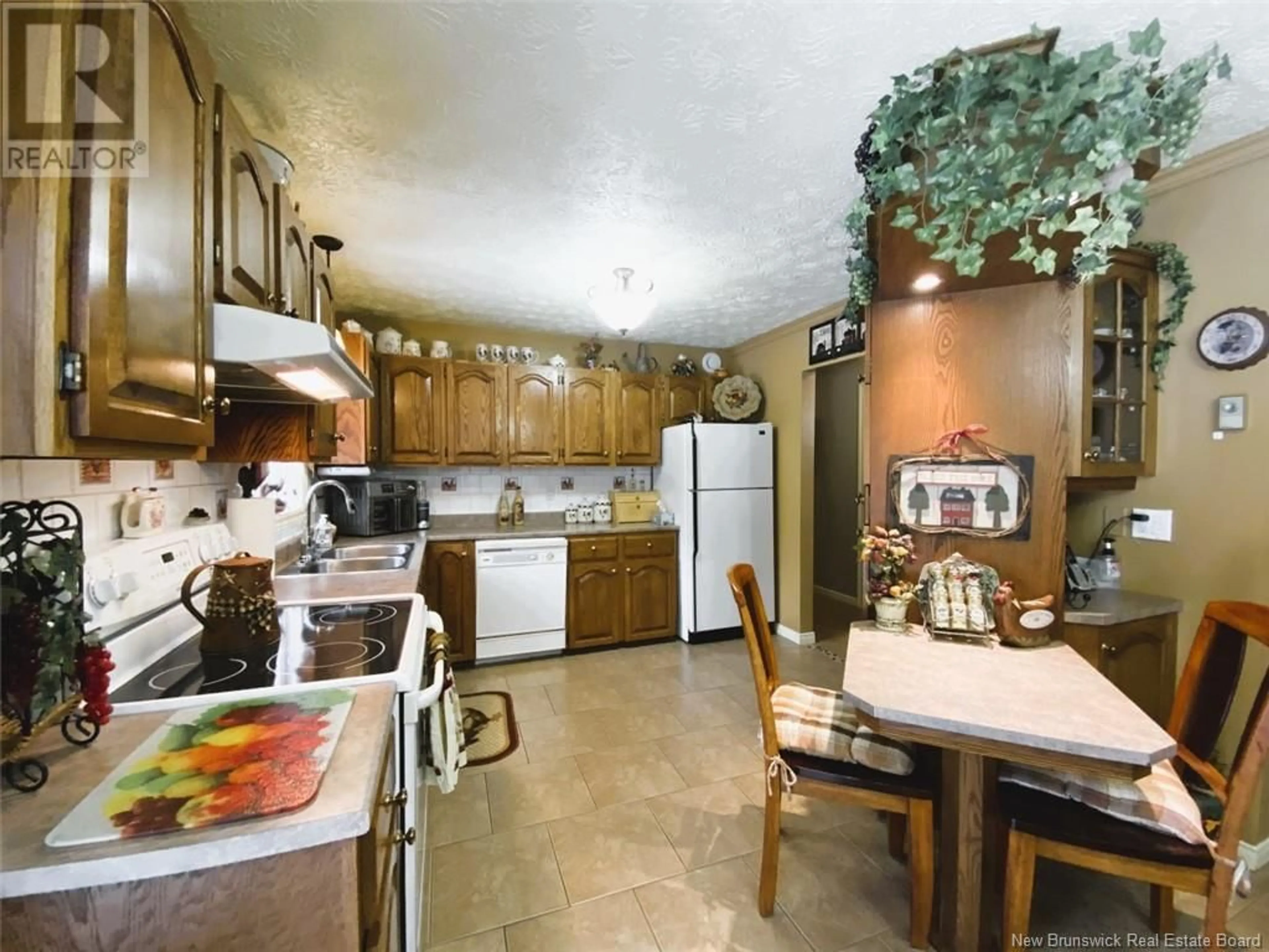 Standard kitchen, ceramic/tile floor for 2799 120 Route, St-Hilaire New Brunswick E3V4T7