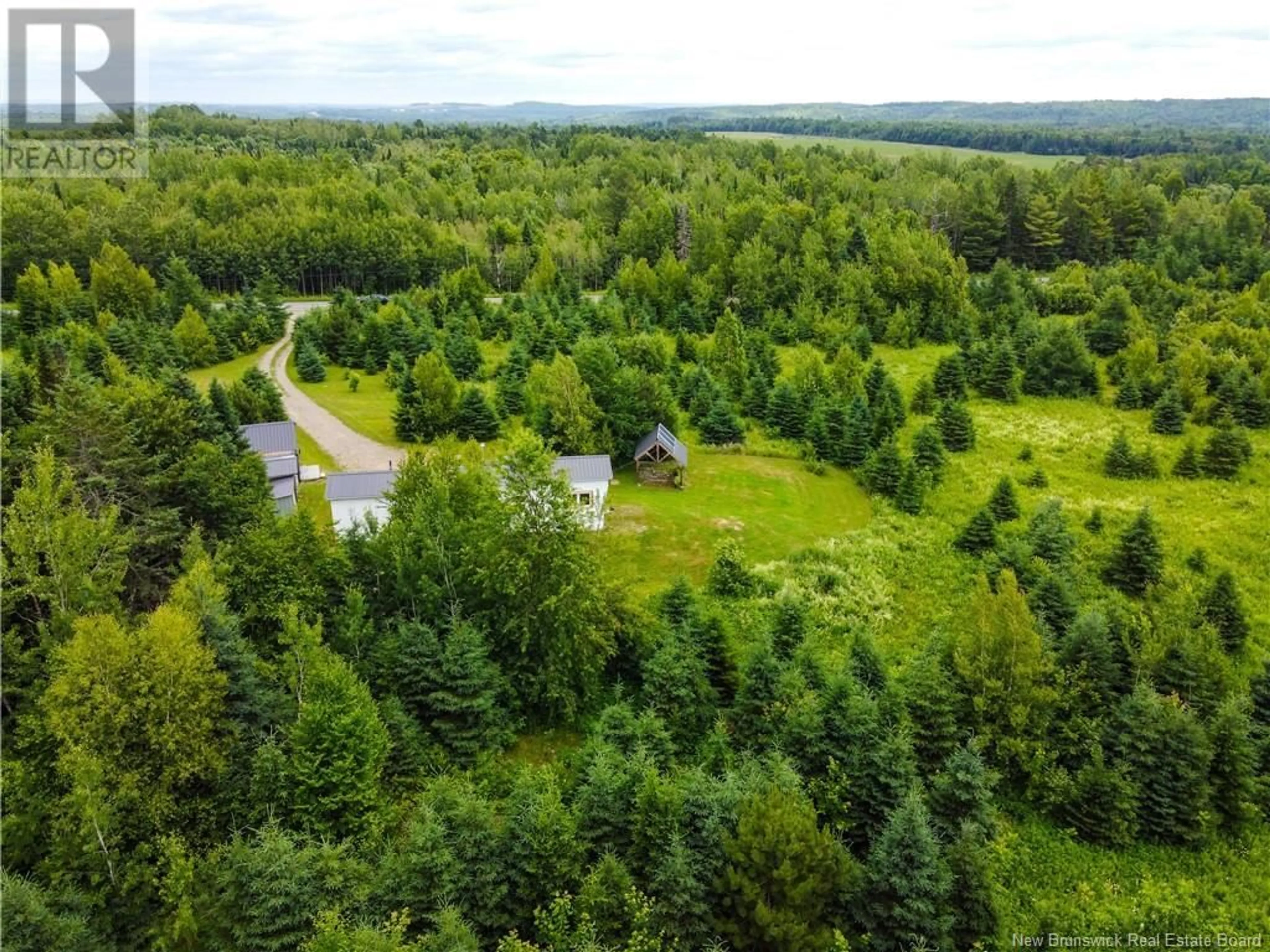 A pic from outside/outdoor area/front of a property/back of a property/a pic from drone, forest/trees view for 563 Watson Settlement Road, Belleville New Brunswick E7M5W3