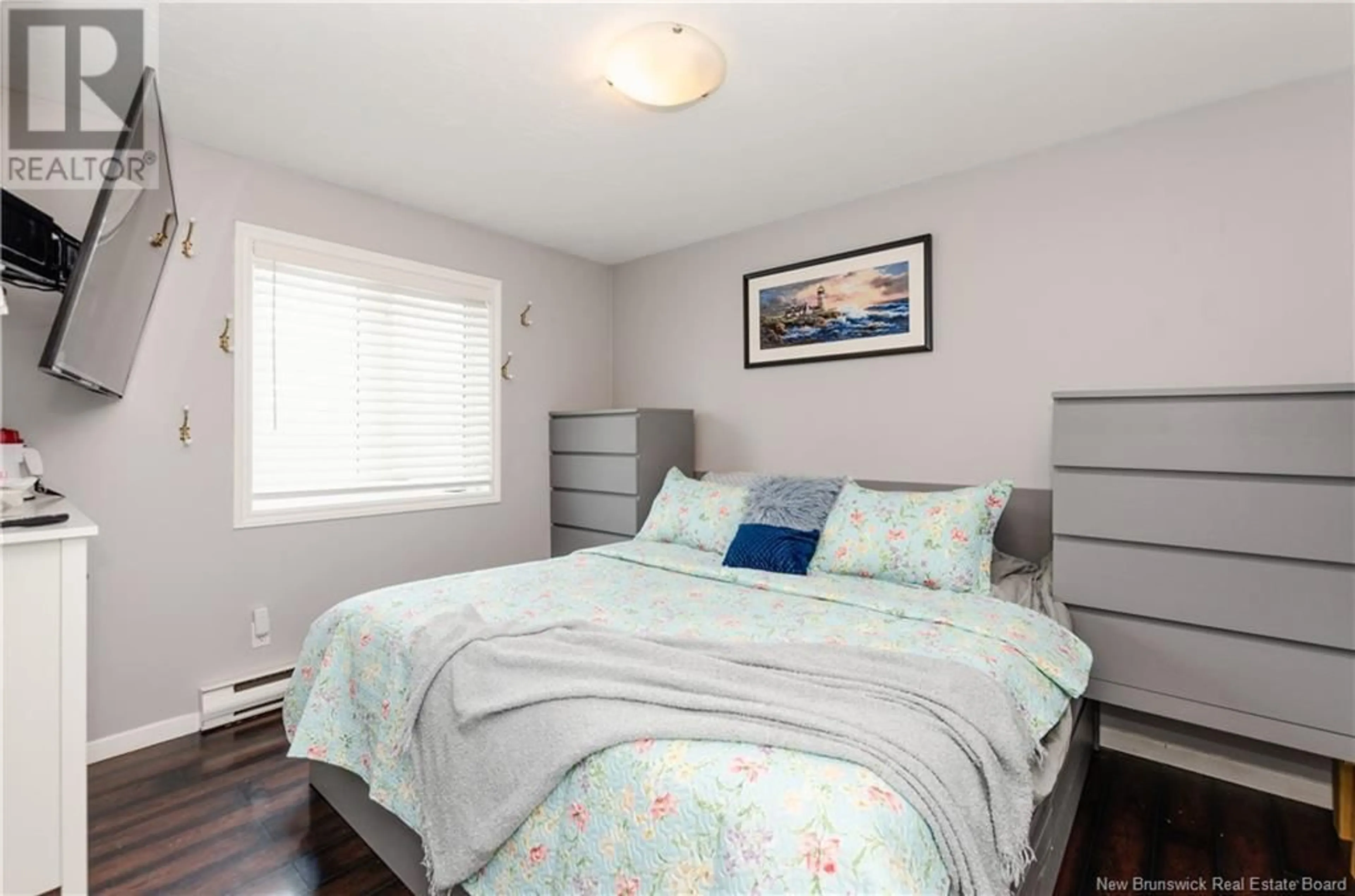 Bedroom with bed, wood/laminate floor for 50 Donald Street, Shediac New Brunswick E4P1P8