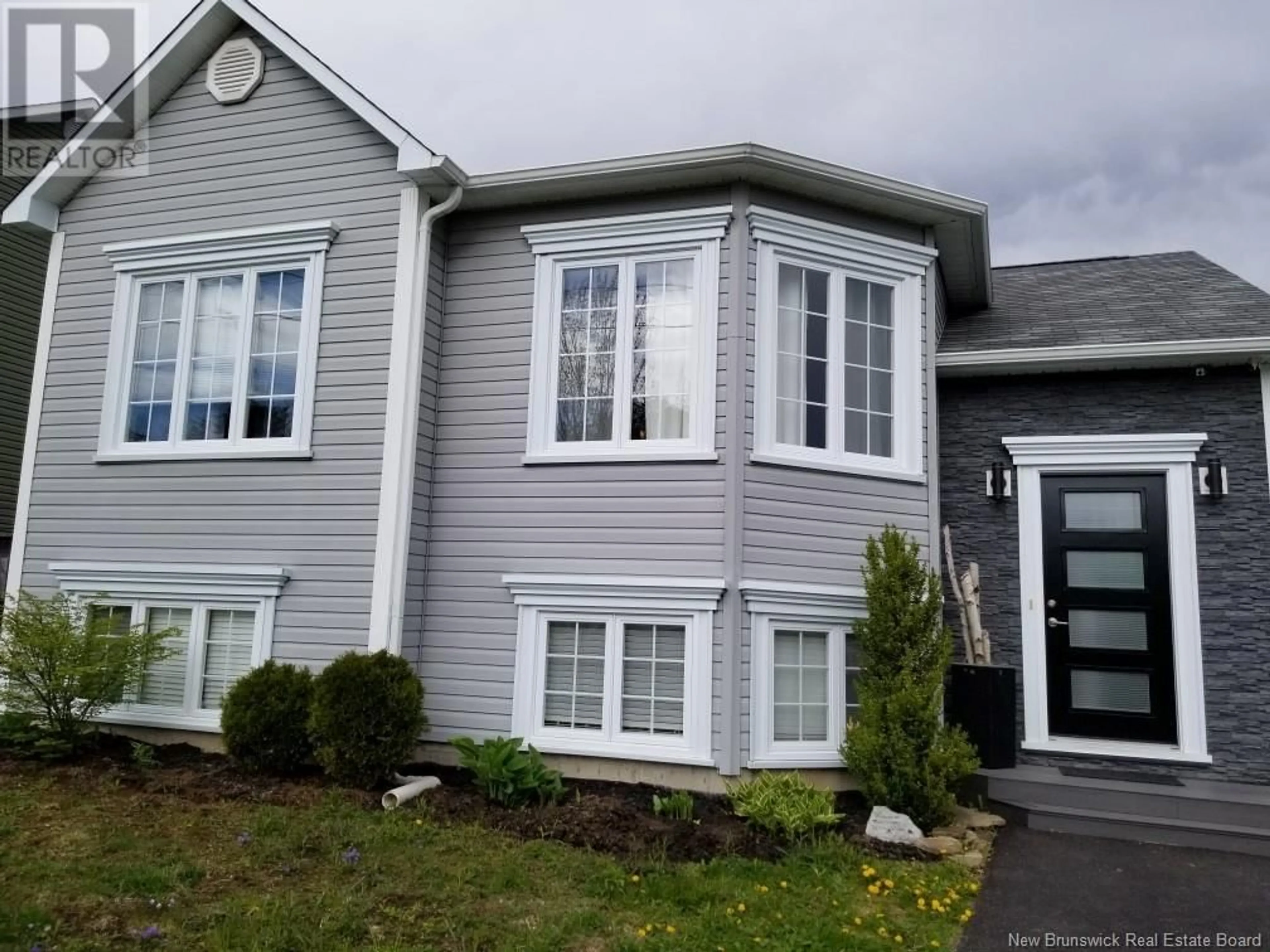 Home with vinyl exterior material, street for 63 Brandon Court, Fredericton New Brunswick E3G0X5