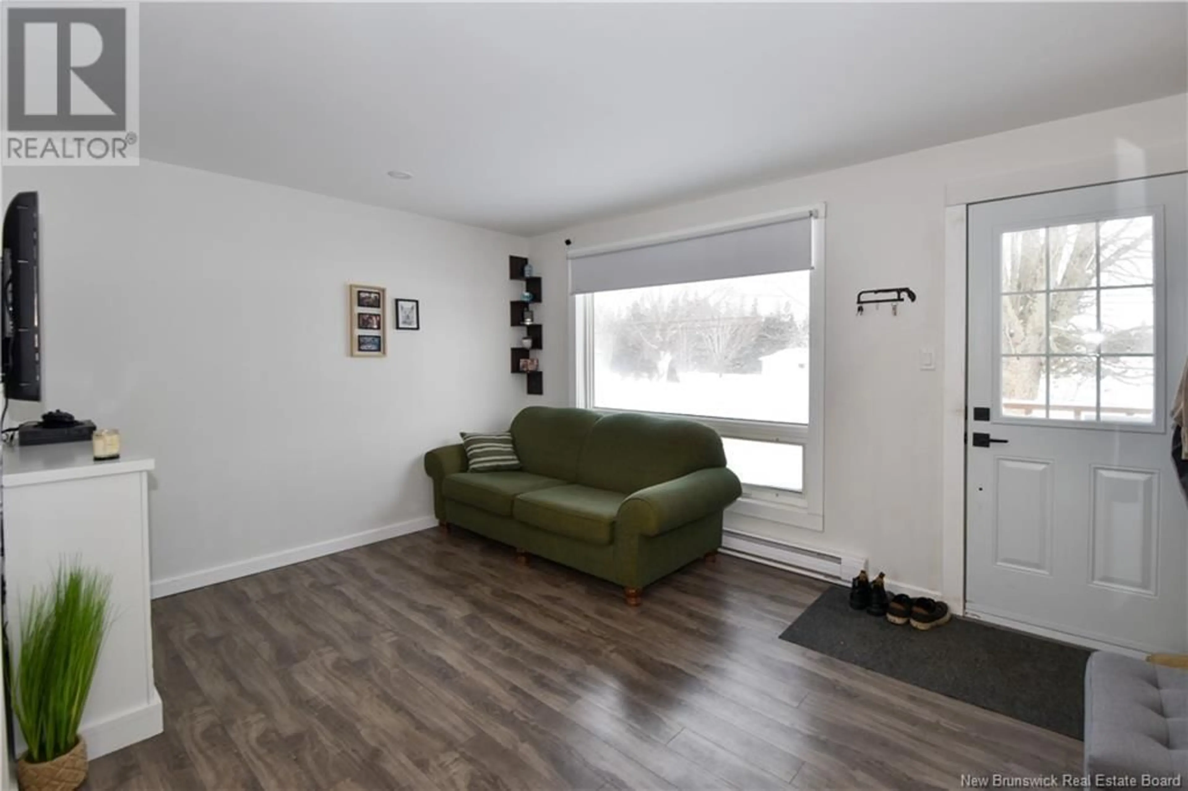 Living room with furniture, wood/laminate floor for 749 SAINT-JOSEPH, Saint-Léolin New Brunswick E8N2N8