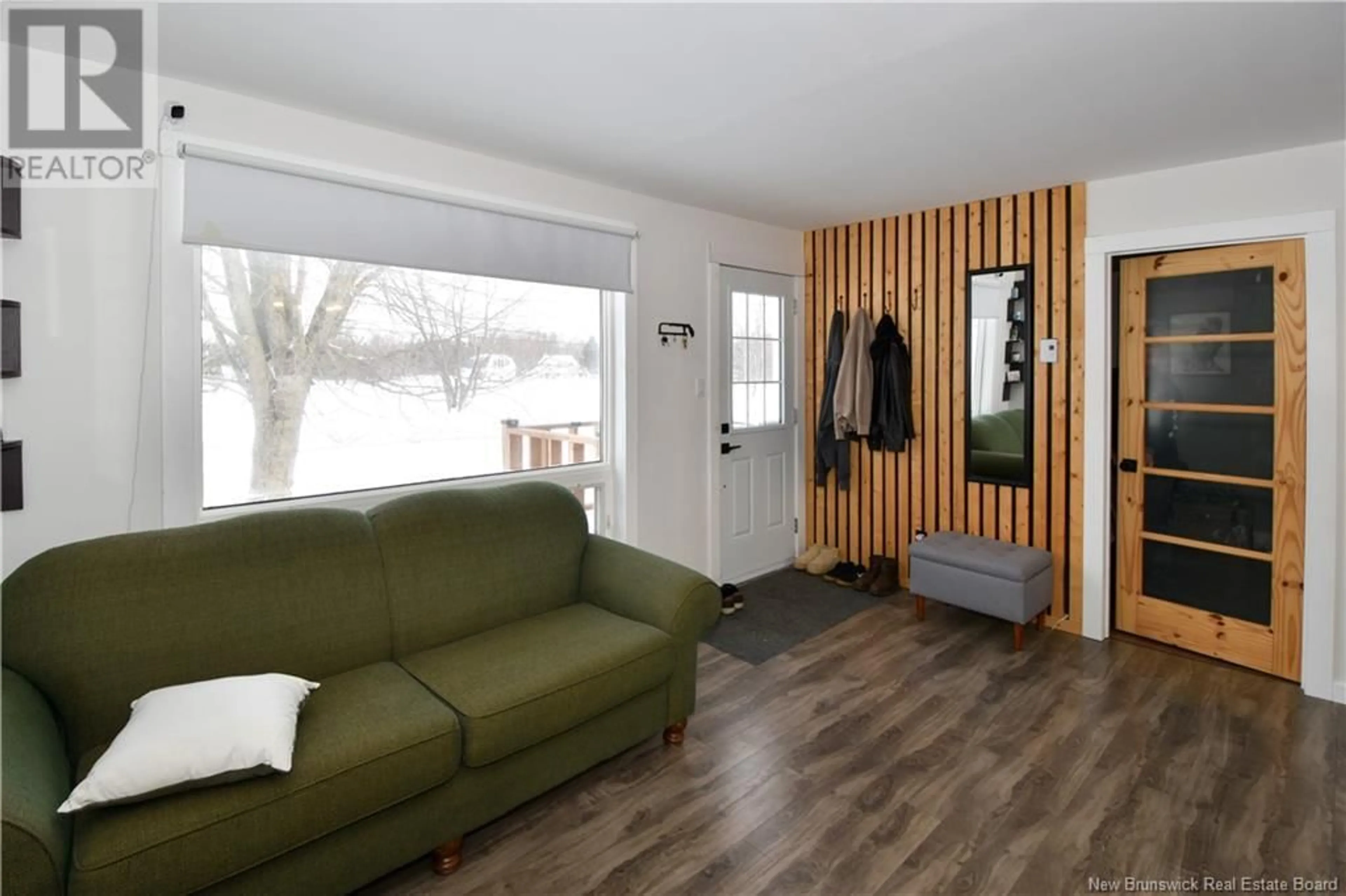 Living room with furniture, wood/laminate floor for 749 SAINT-JOSEPH, Saint-Léolin New Brunswick E8N2N8