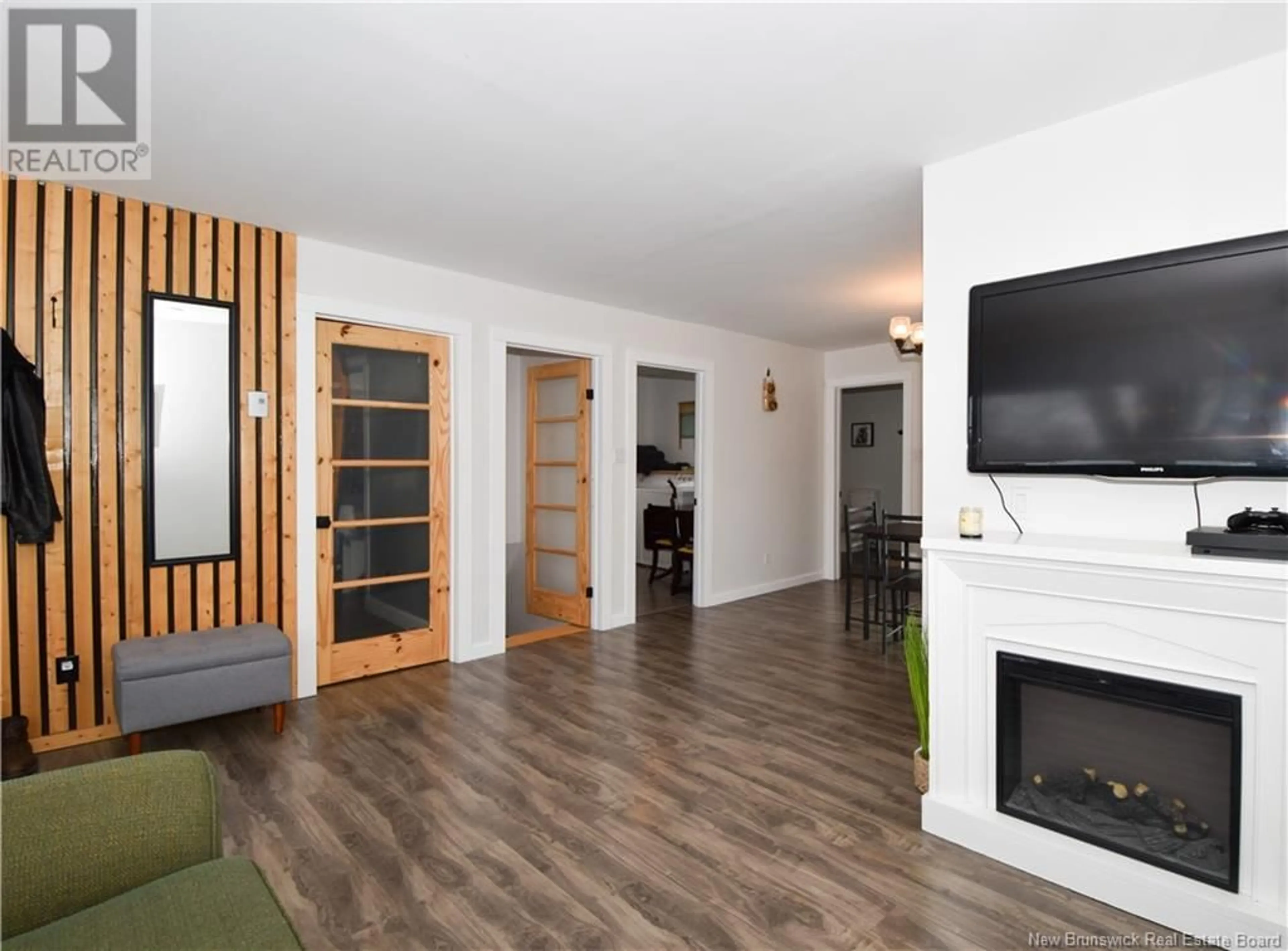 Living room with furniture, wood/laminate floor for 749 SAINT-JOSEPH, Saint-Léolin New Brunswick E8N2N8