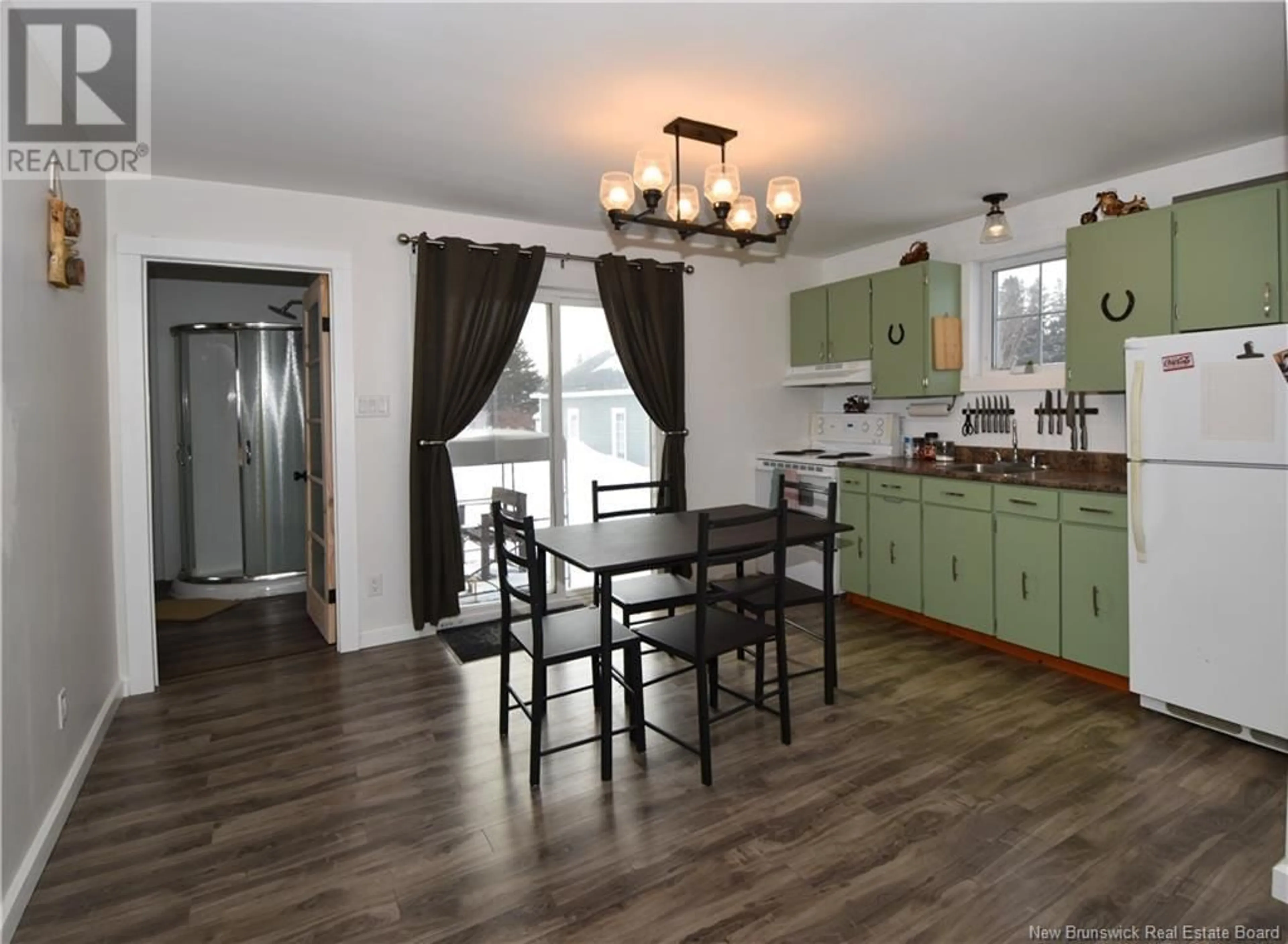 Open concept kitchen, wood/laminate floor for 749 Saint-Joseph, Saint-Léolin New Brunswick E8N2N8