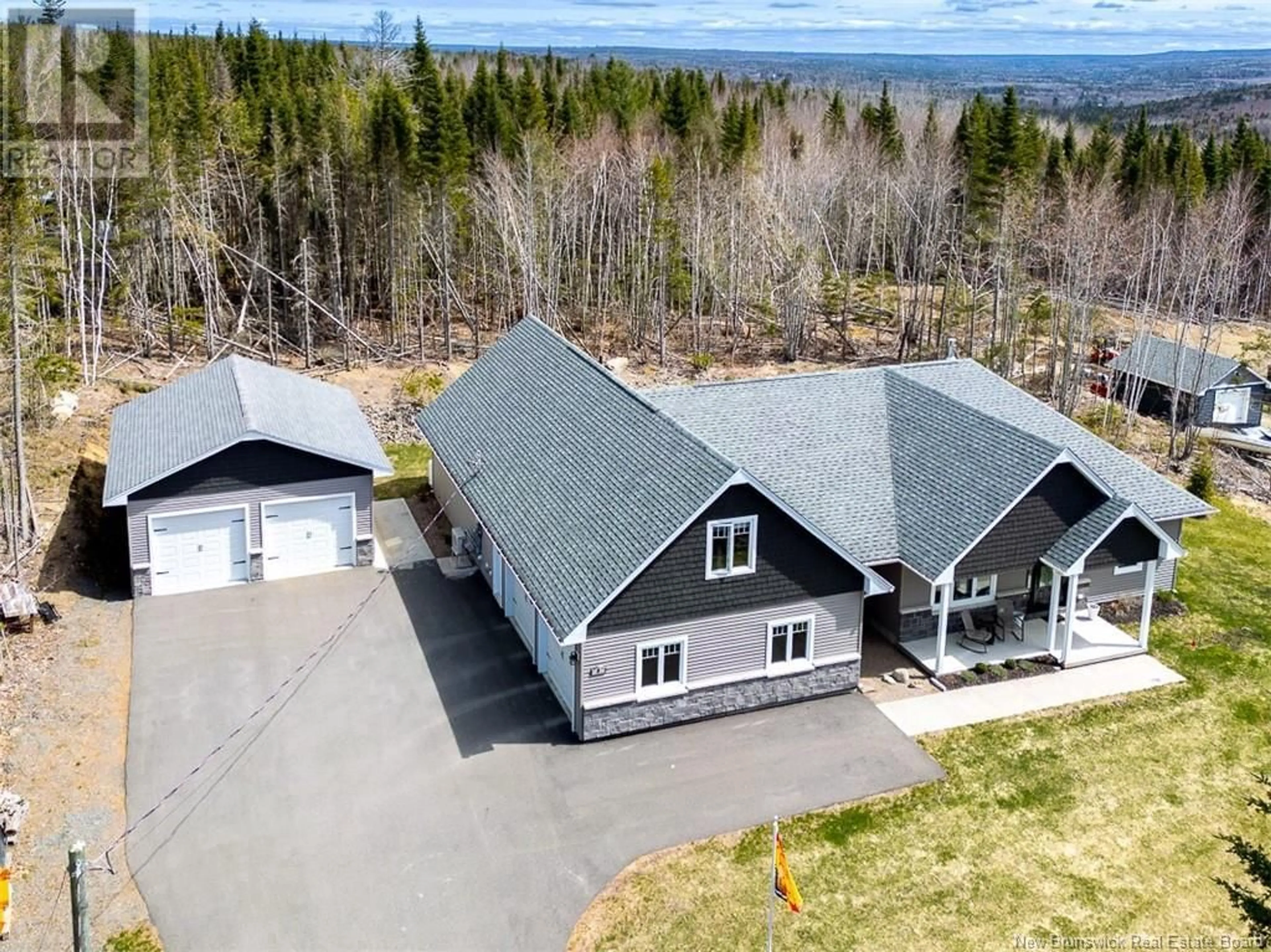 A pic from outside/outdoor area/front of a property/back of a property/a pic from drone, unknown for 9 Leeland Way, Killarney Road New Brunswick E3A5M7