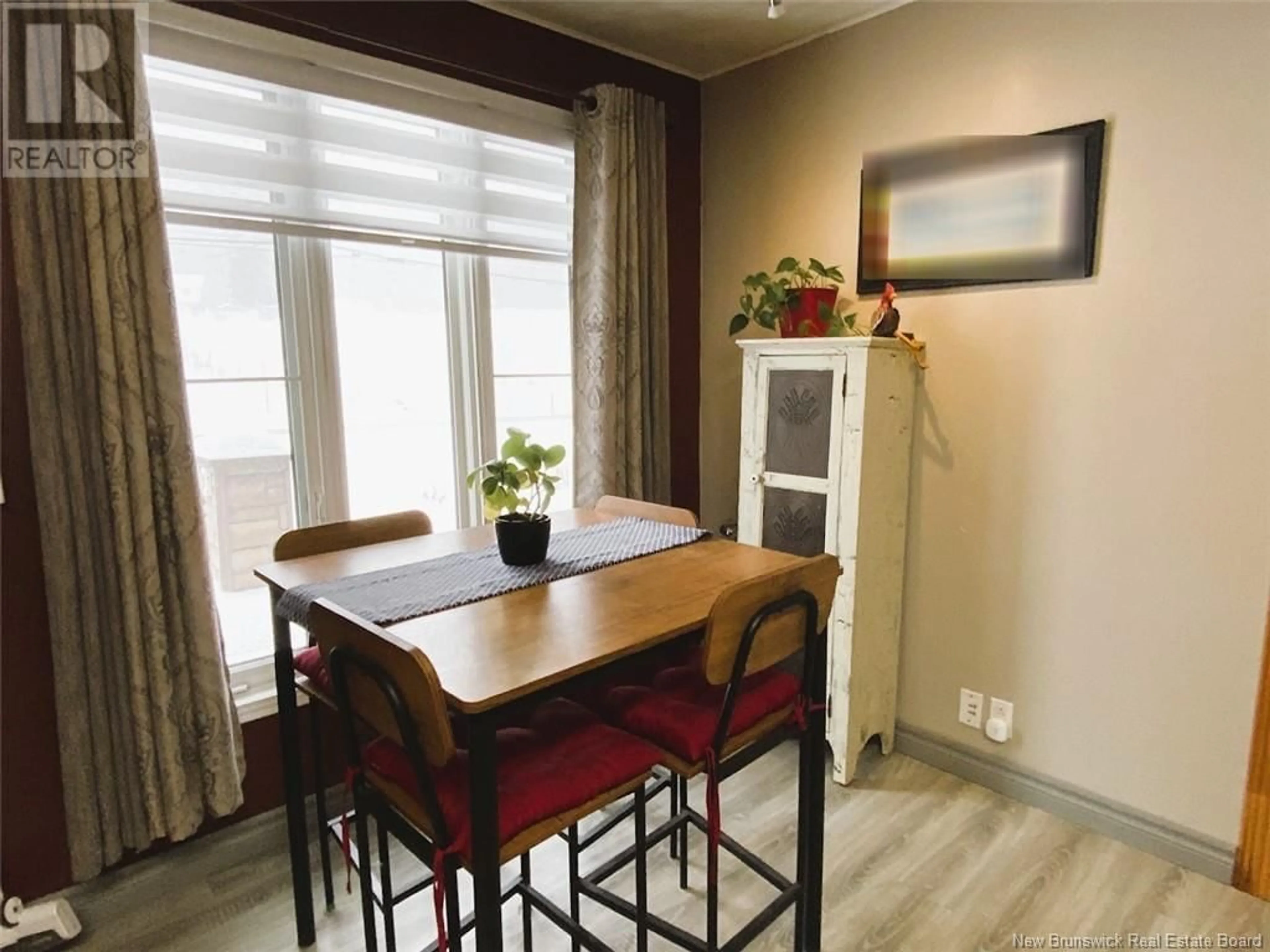 Dining room, wood/laminate floor for 871 Canada Road, Edmundston New Brunswick E3V3X1