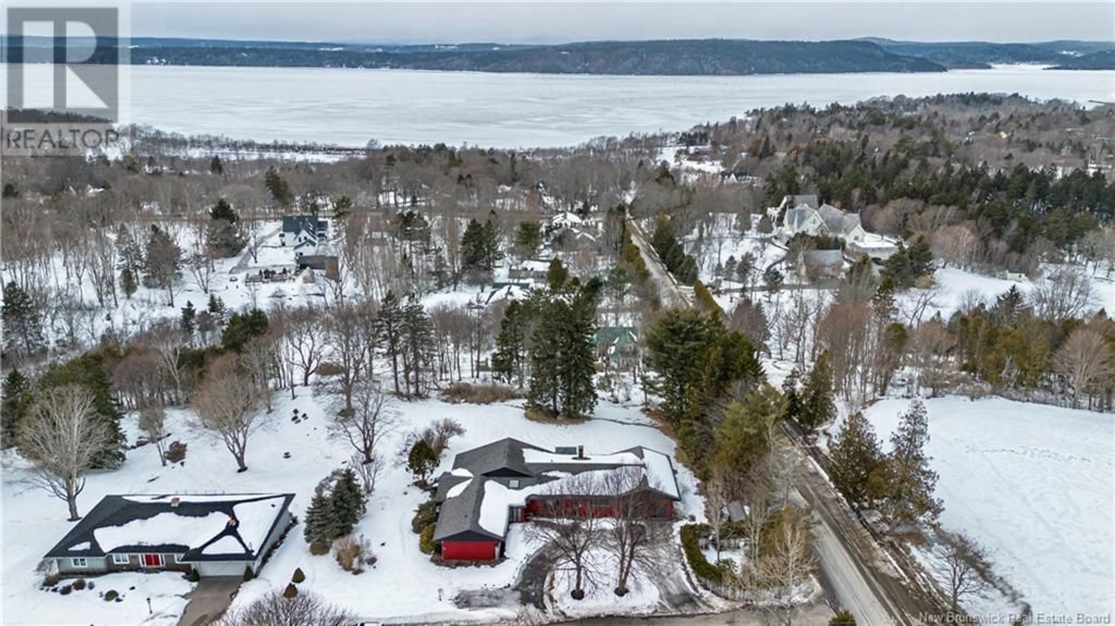 A pic from outside/outdoor area/front of a property/back of a property/a pic from drone, water/lake/river/ocean view for 1 Fairweather Lane, Rothesay New Brunswick E2E5L9