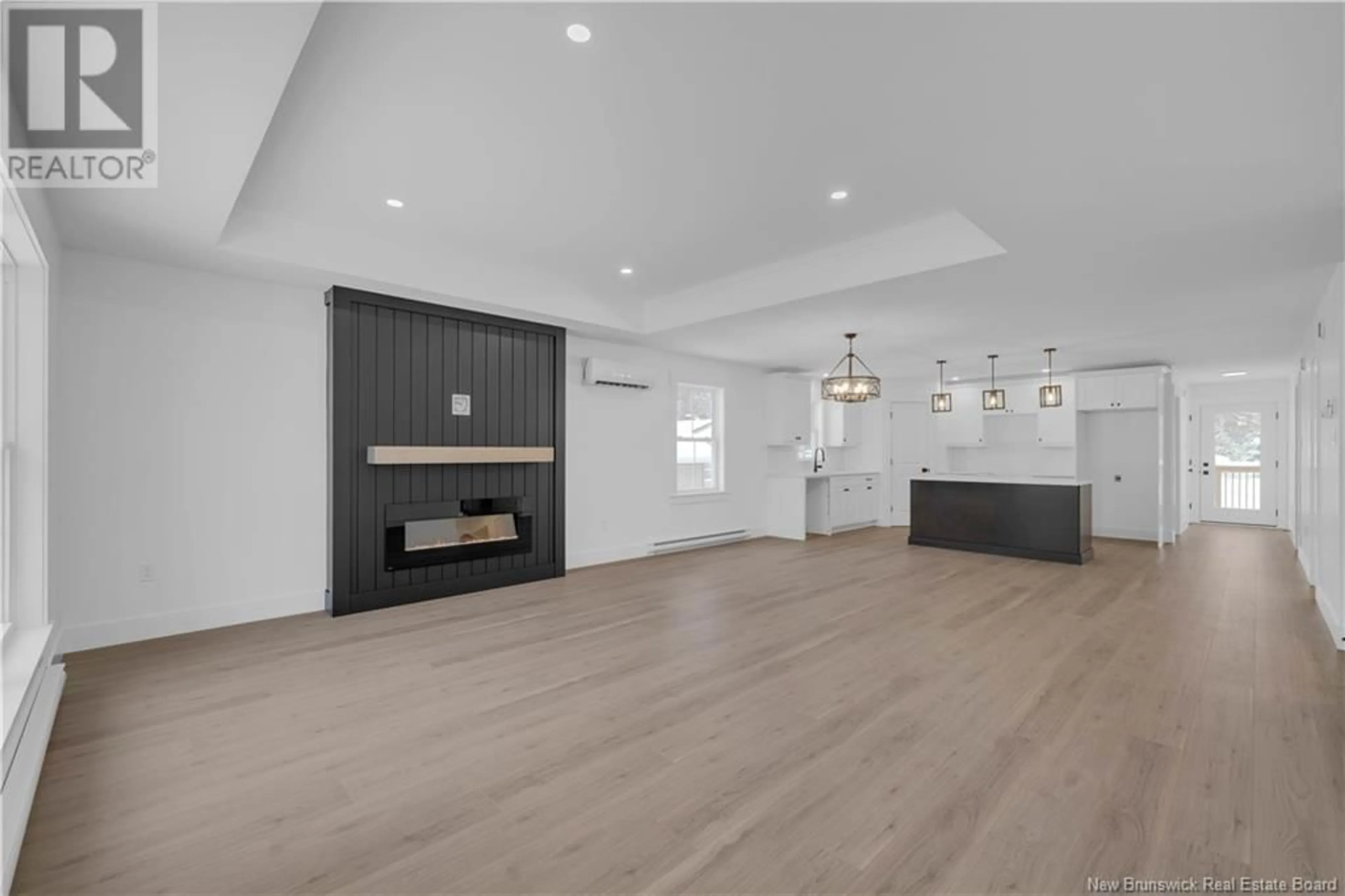 Open concept kitchen, wood/laminate floor for 77 Walker Crescent, Hampton New Brunswick E5N5Z7