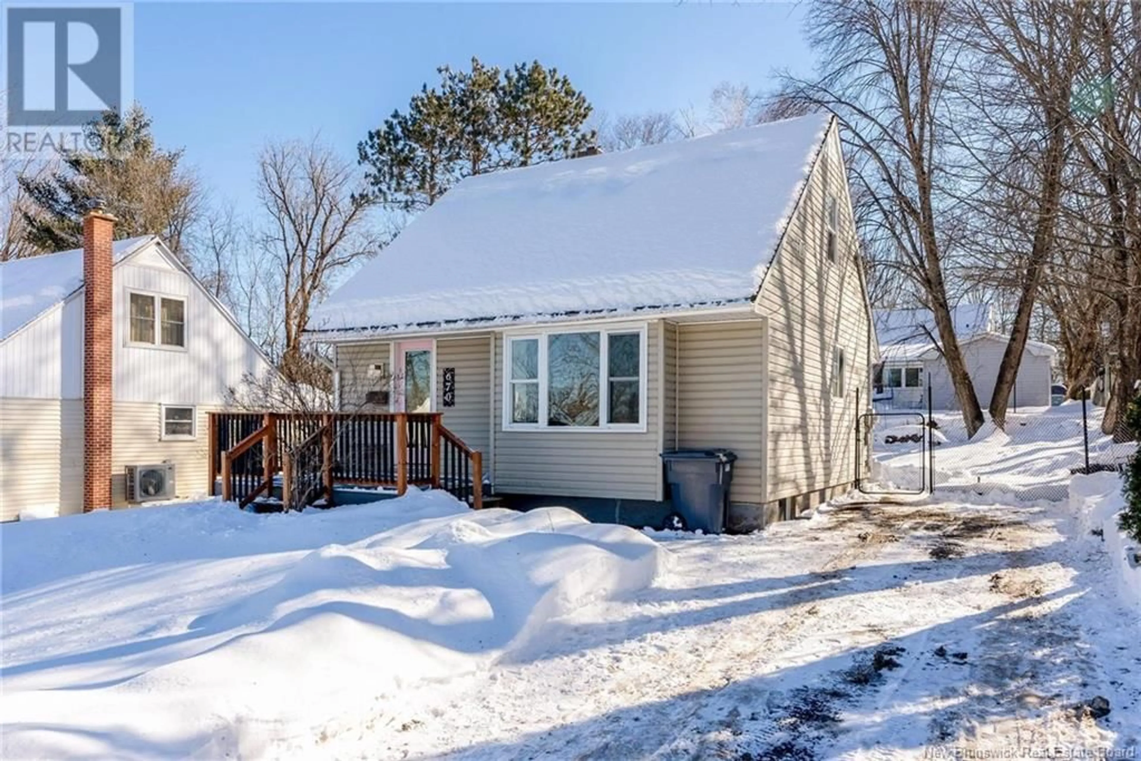 Home with vinyl exterior material, street for 670 Reid Street, Fredericton New Brunswick E3B3V5