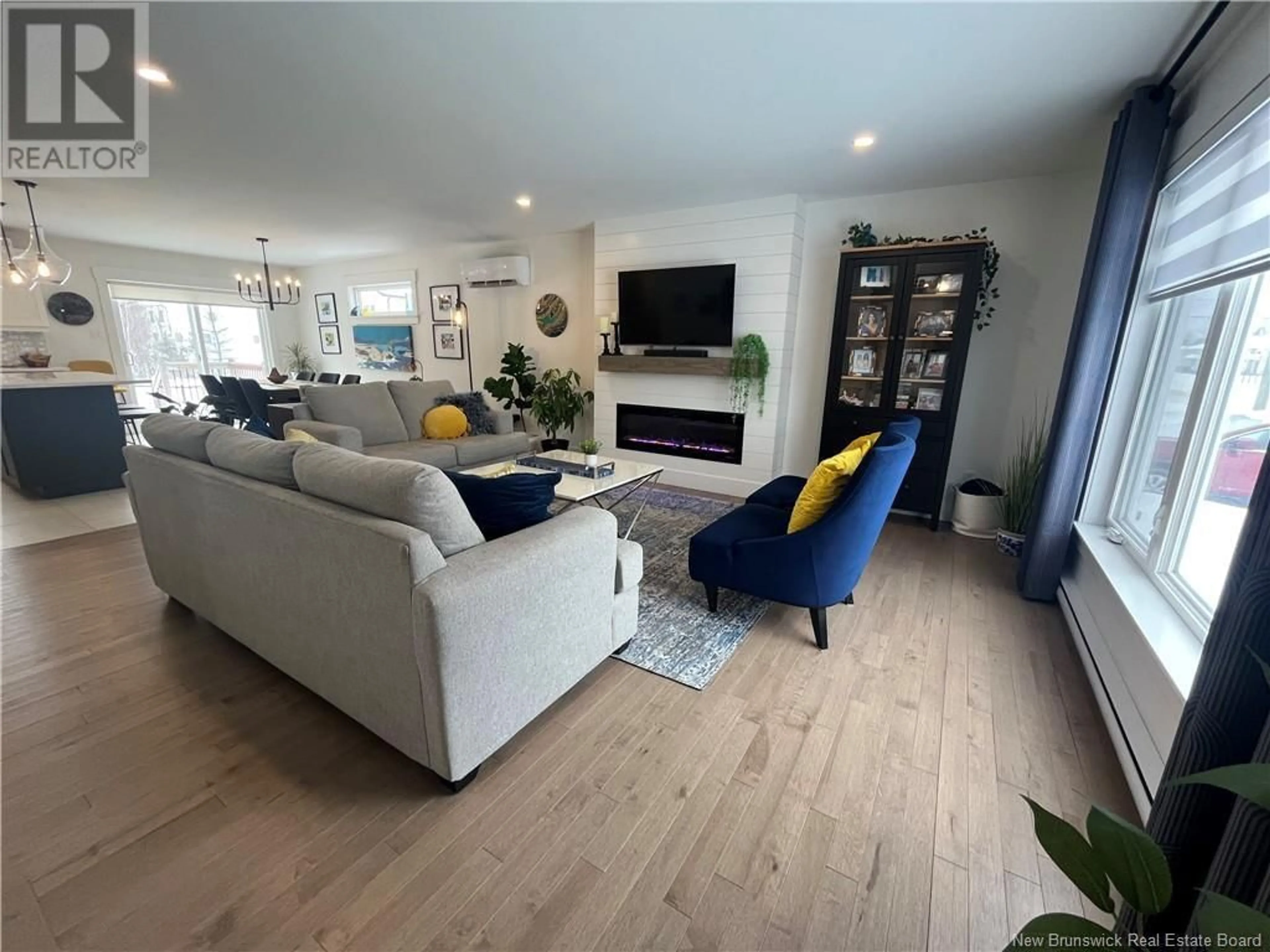Living room with furniture, wood/laminate floor for 426 MAPLEHURST DRIVE, Moncton New Brunswick E1G6C9