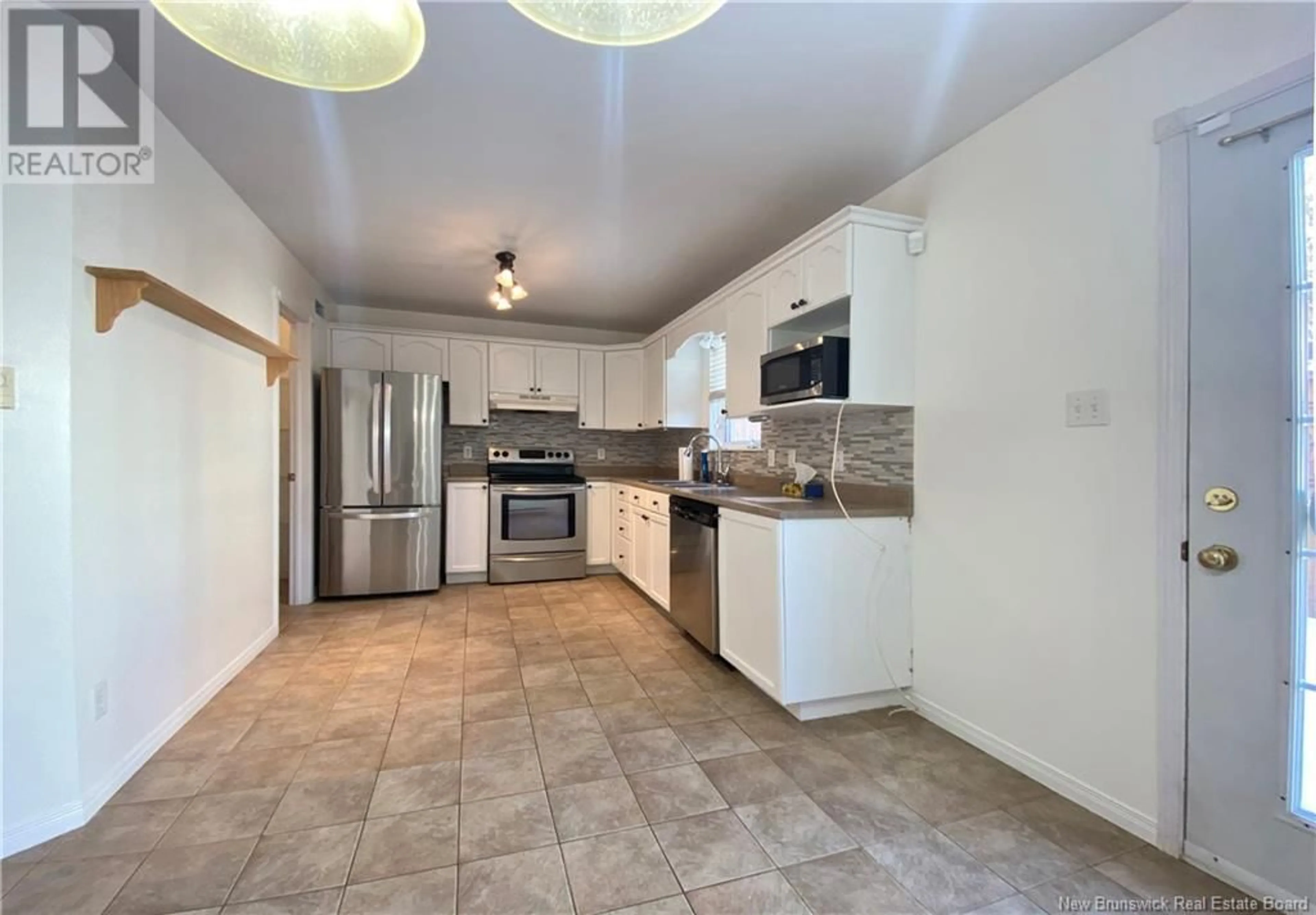 Open concept kitchen, ceramic/tile floor for 37 Old Orchard Lane, Riverview New Brunswick E1B5M5