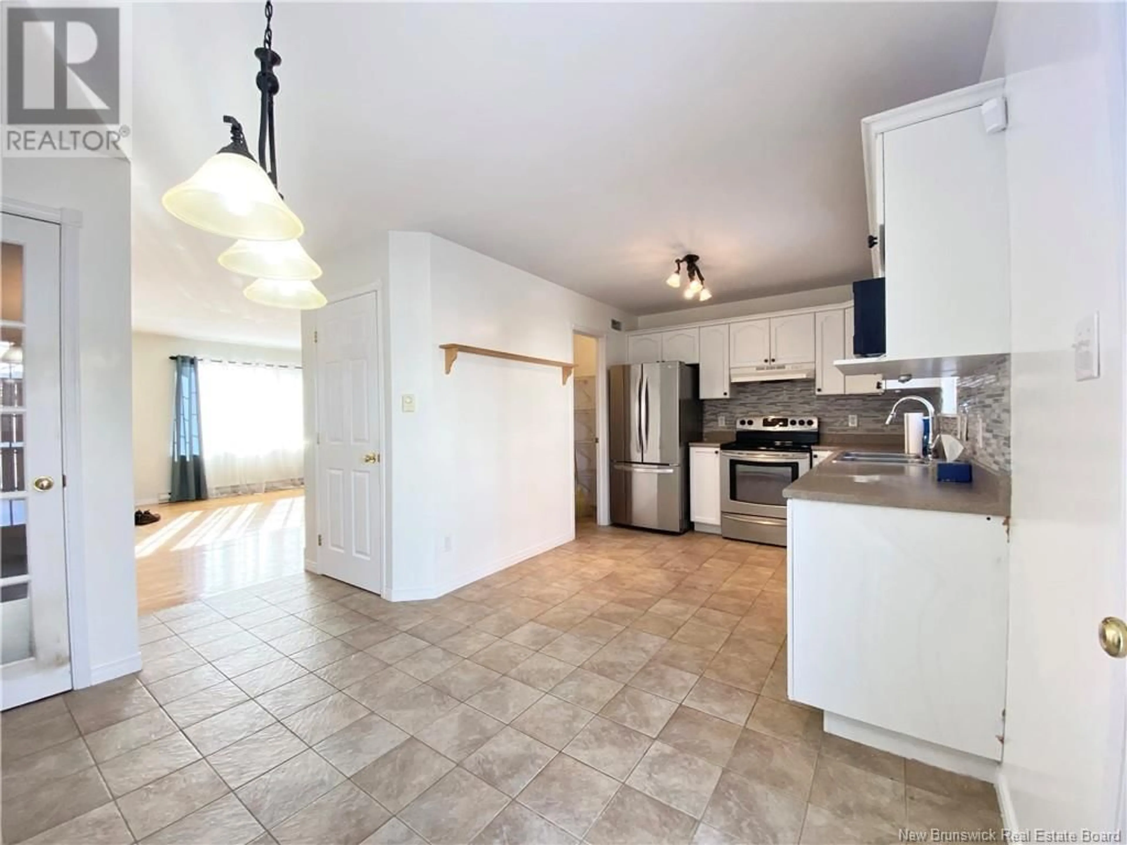 Open concept kitchen, ceramic/tile floor for 37 Old Orchard Lane, Riverview New Brunswick E1B5M5