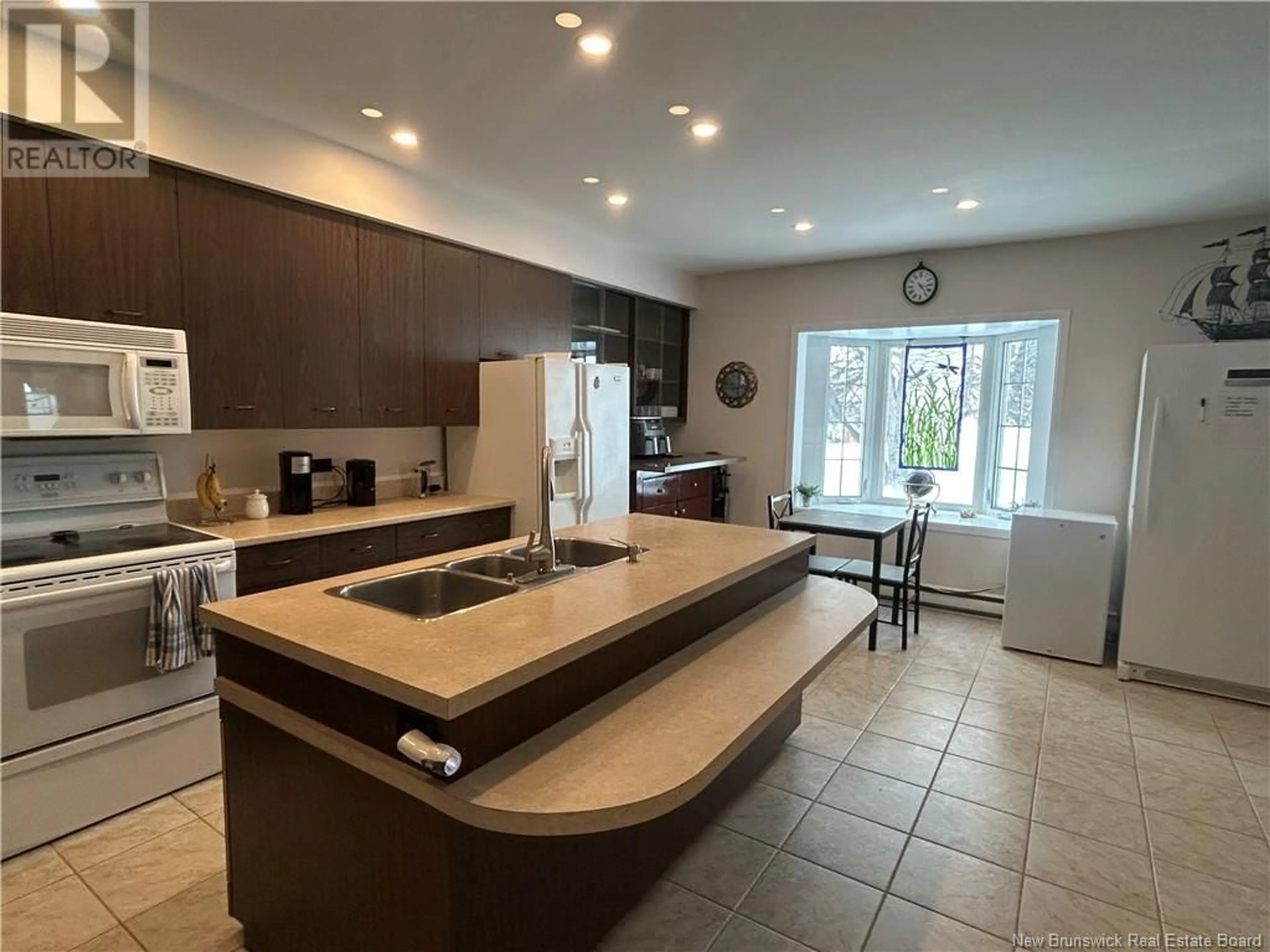 Open concept kitchen, ceramic/tile floor for 69 CHURCH STREET, Grand-Sault/Grand Falls New Brunswick E3Z2N3