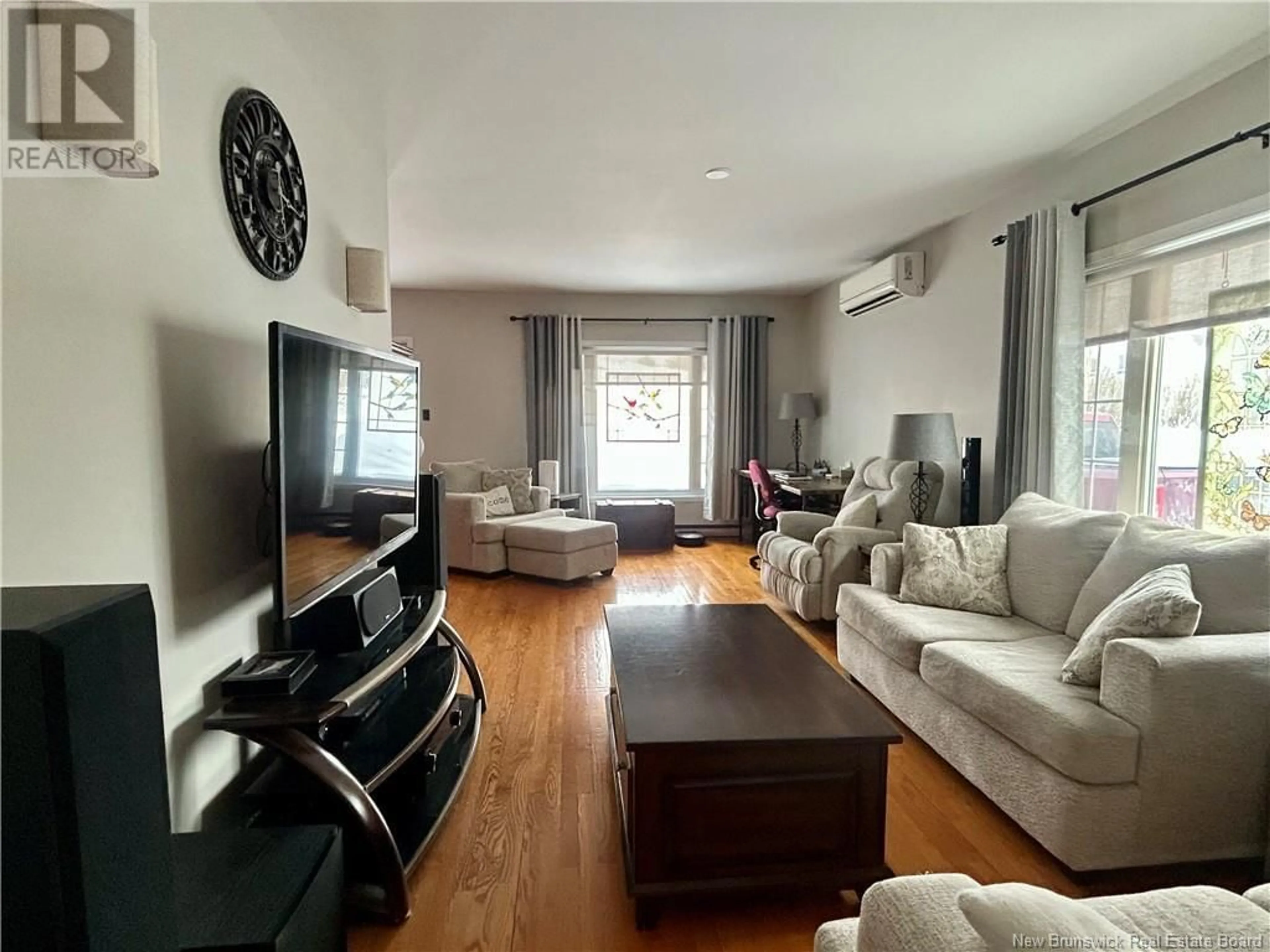 Living room with furniture, wood/laminate floor for 69 CHURCH STREET, Grand-Sault/Grand Falls New Brunswick E3Z2N3