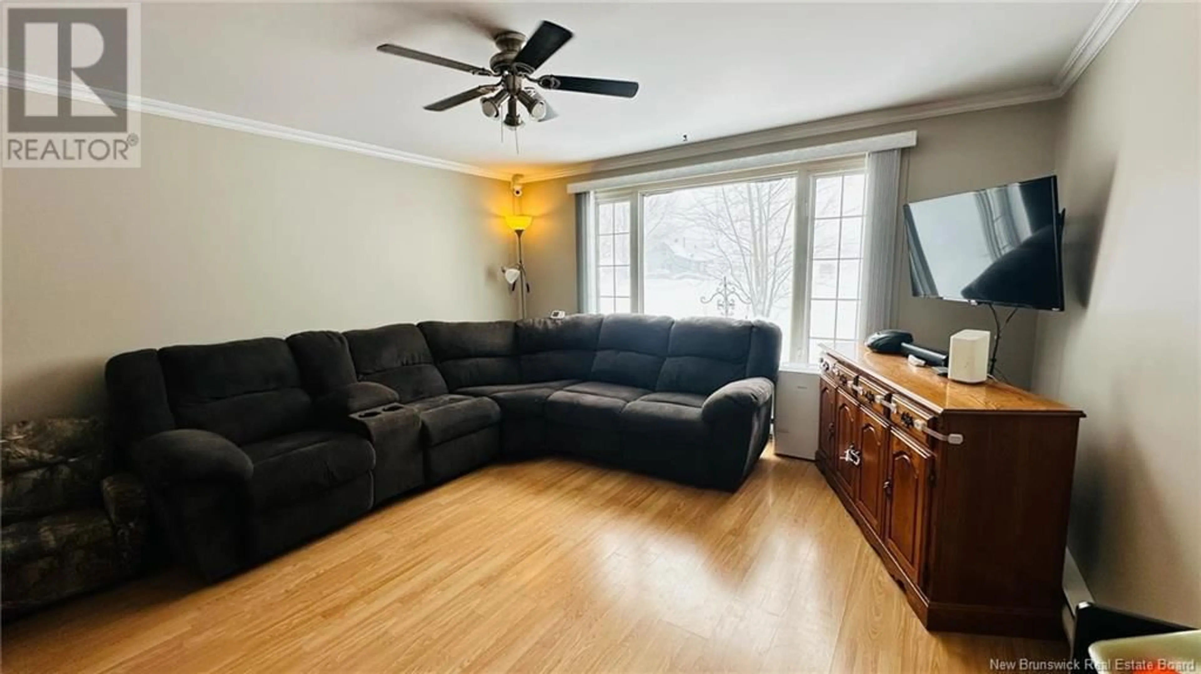 Living room with furniture, wood/laminate floor for 19 Ch Saint-Pierre Road, Rogersville New Brunswick E4Y1L3