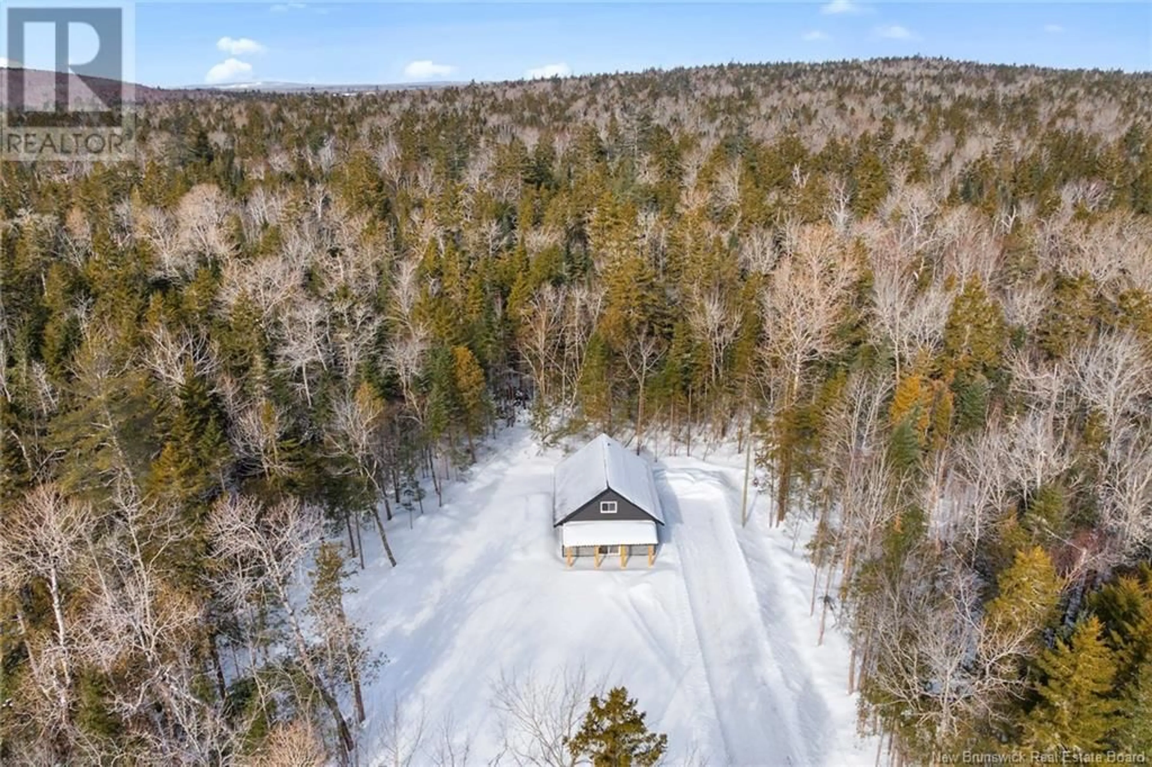 A pic from outside/outdoor area/front of a property/back of a property/a pic from drone, forest/trees view for 108 John Chessie Drive, Yoho New Brunswick E6K2Z6