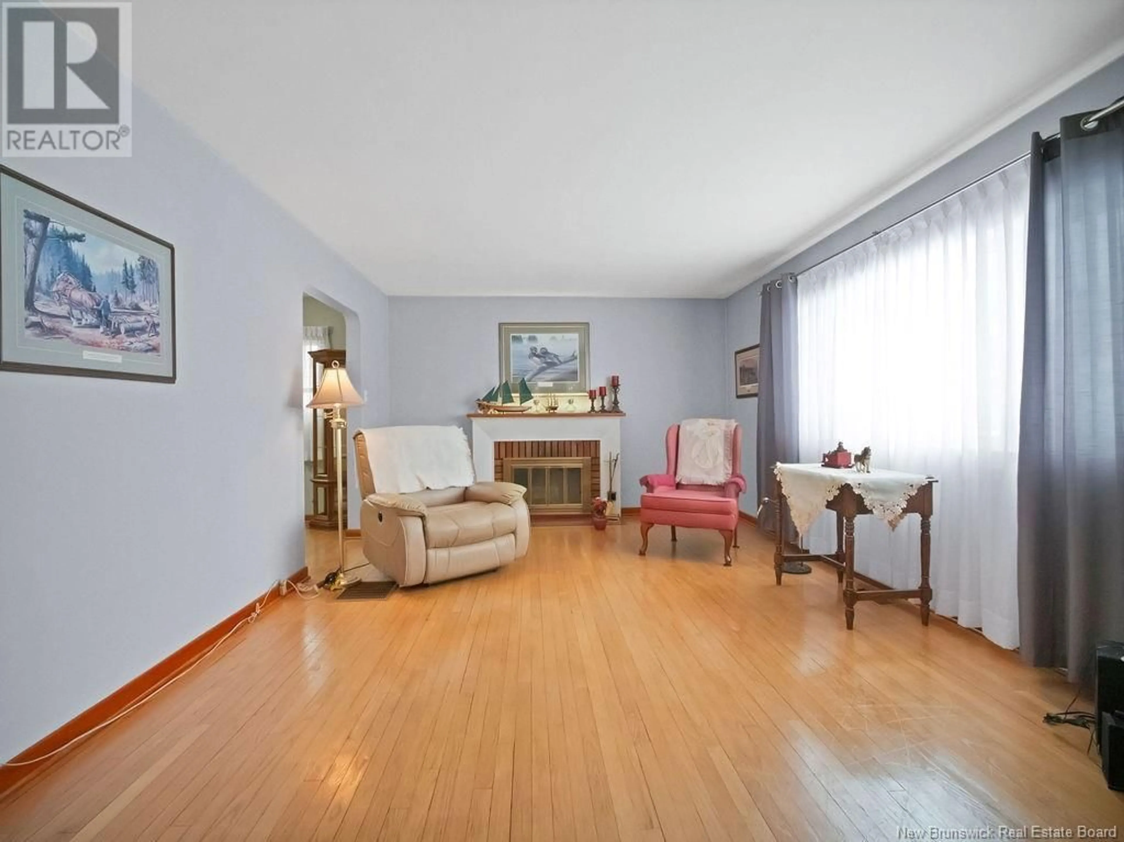 Living room with furniture, wood/laminate floor for 94 HEDGEWOOD, Moncton New Brunswick E1E2W5