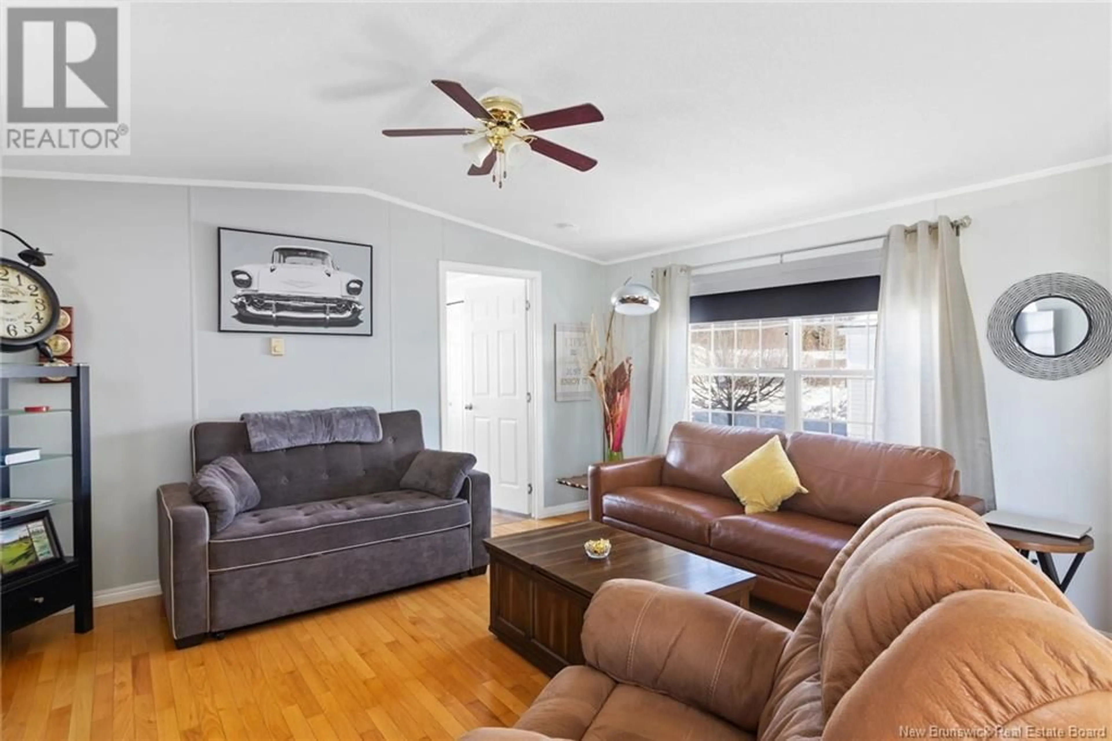 Living room with furniture, wood/laminate floor for 66 Glenmar Drive, Fredericton New Brunswick E3G0H9