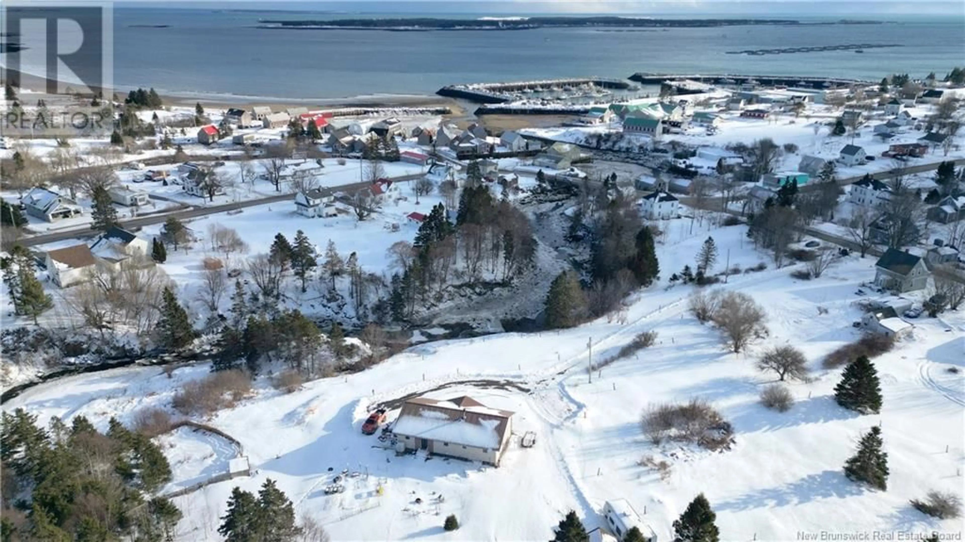 A pic from outside/outdoor area/front of a property/back of a property/a pic from drone, water/lake/river/ocean view for 8 King Street, Grand Manan New Brunswick E5G3J1