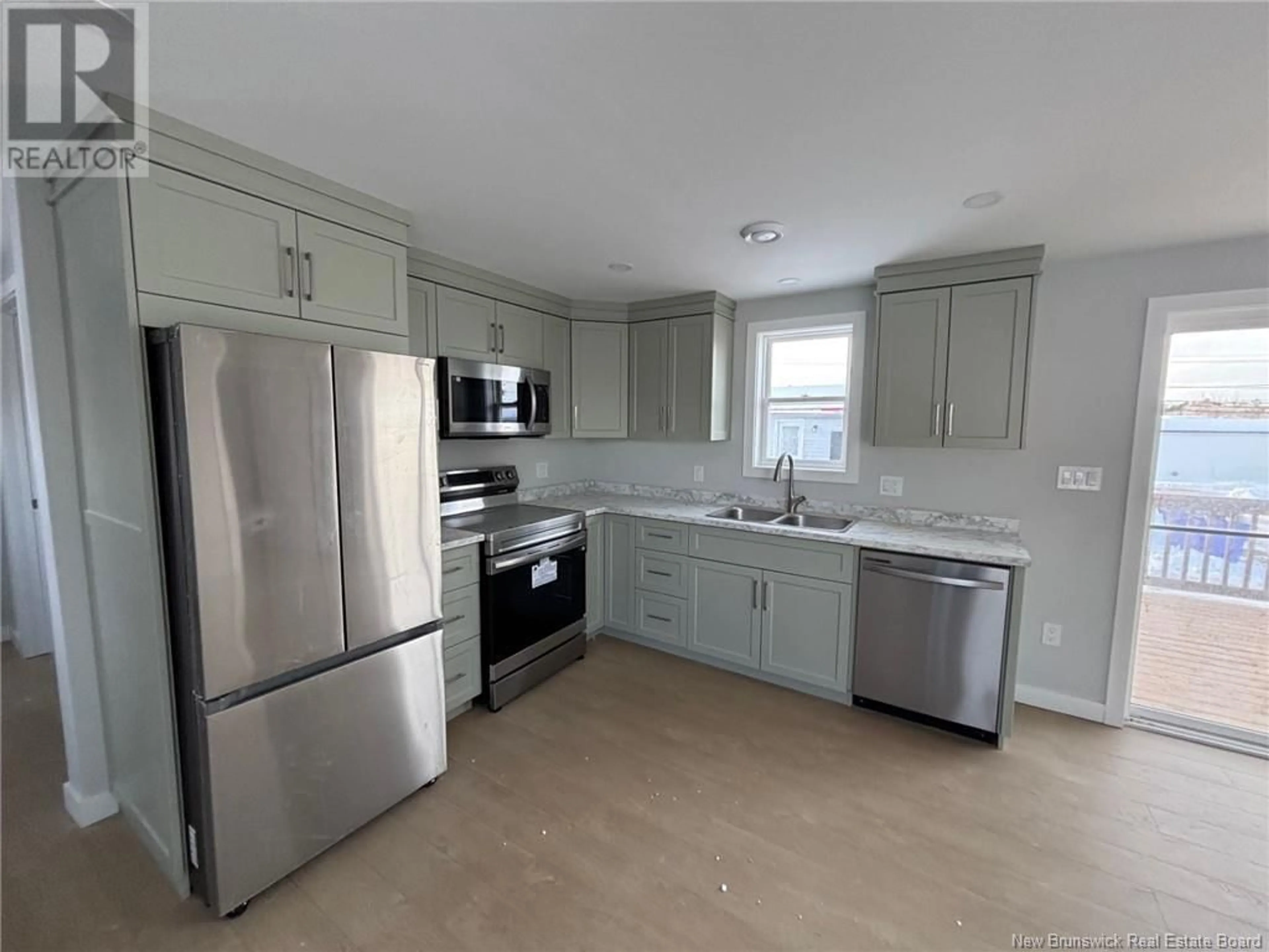 Open concept kitchen, unknown for 8 Fraser, St. Stephen New Brunswick E3L4B8