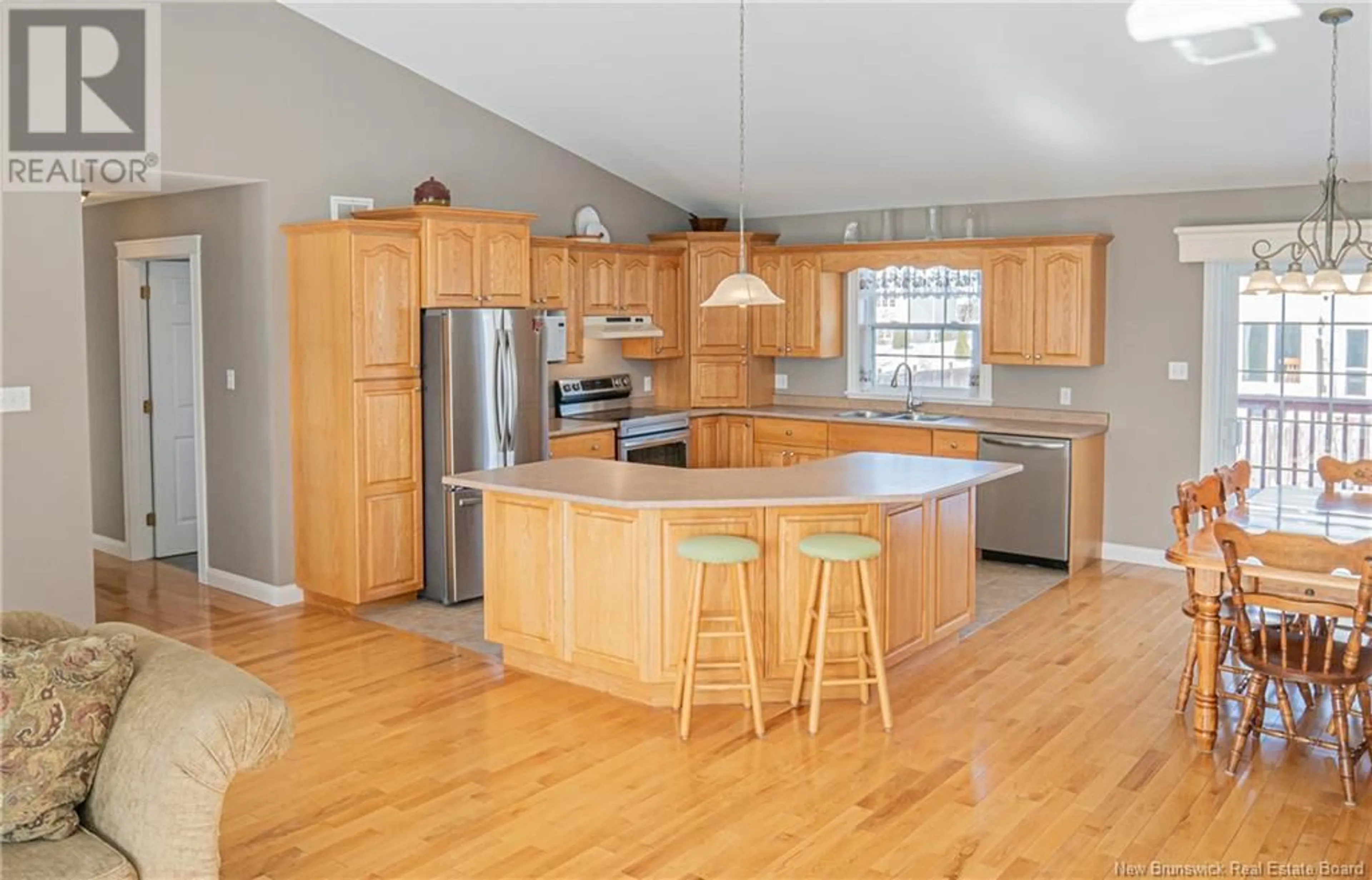 Open concept kitchen, wood/laminate floor for 49 Willingdon Street, Oromocto New Brunswick E2V2S2