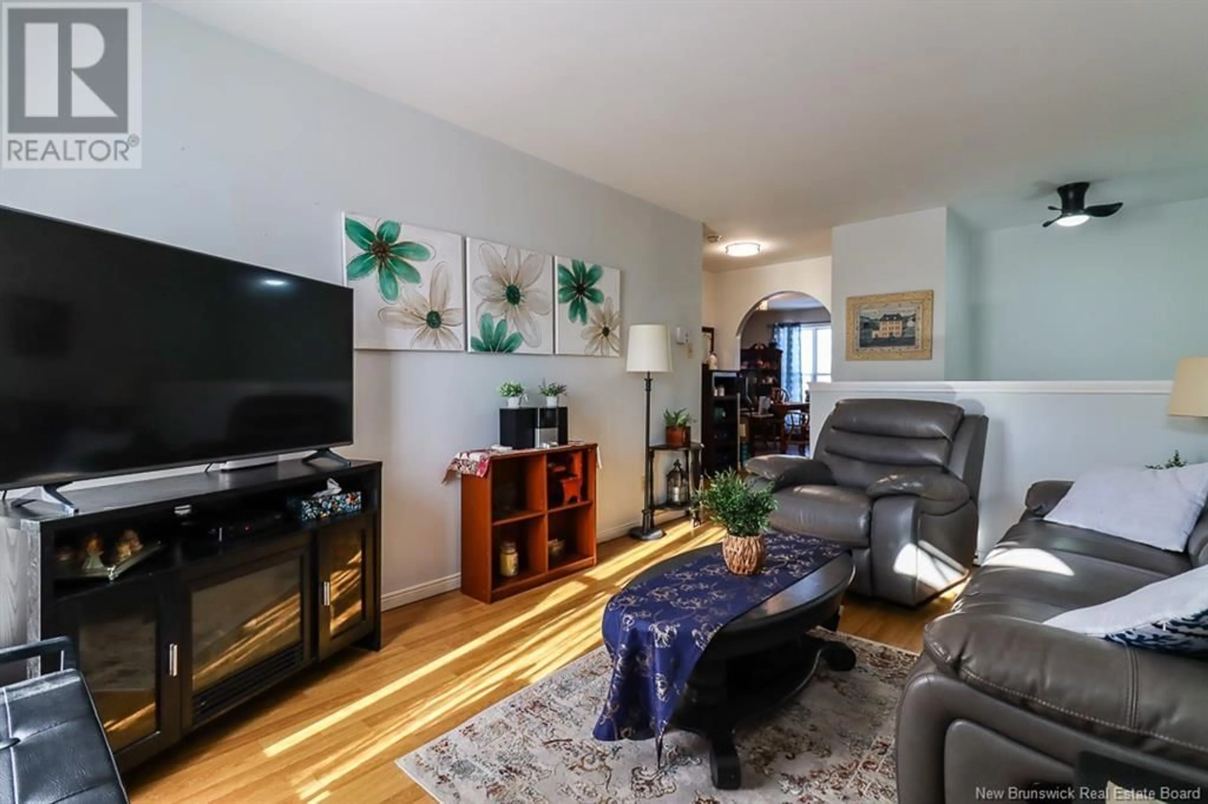 Living room with furniture, wood/laminate floor for 84 Boyaner Crescent, Saint John New Brunswick E2J4C7