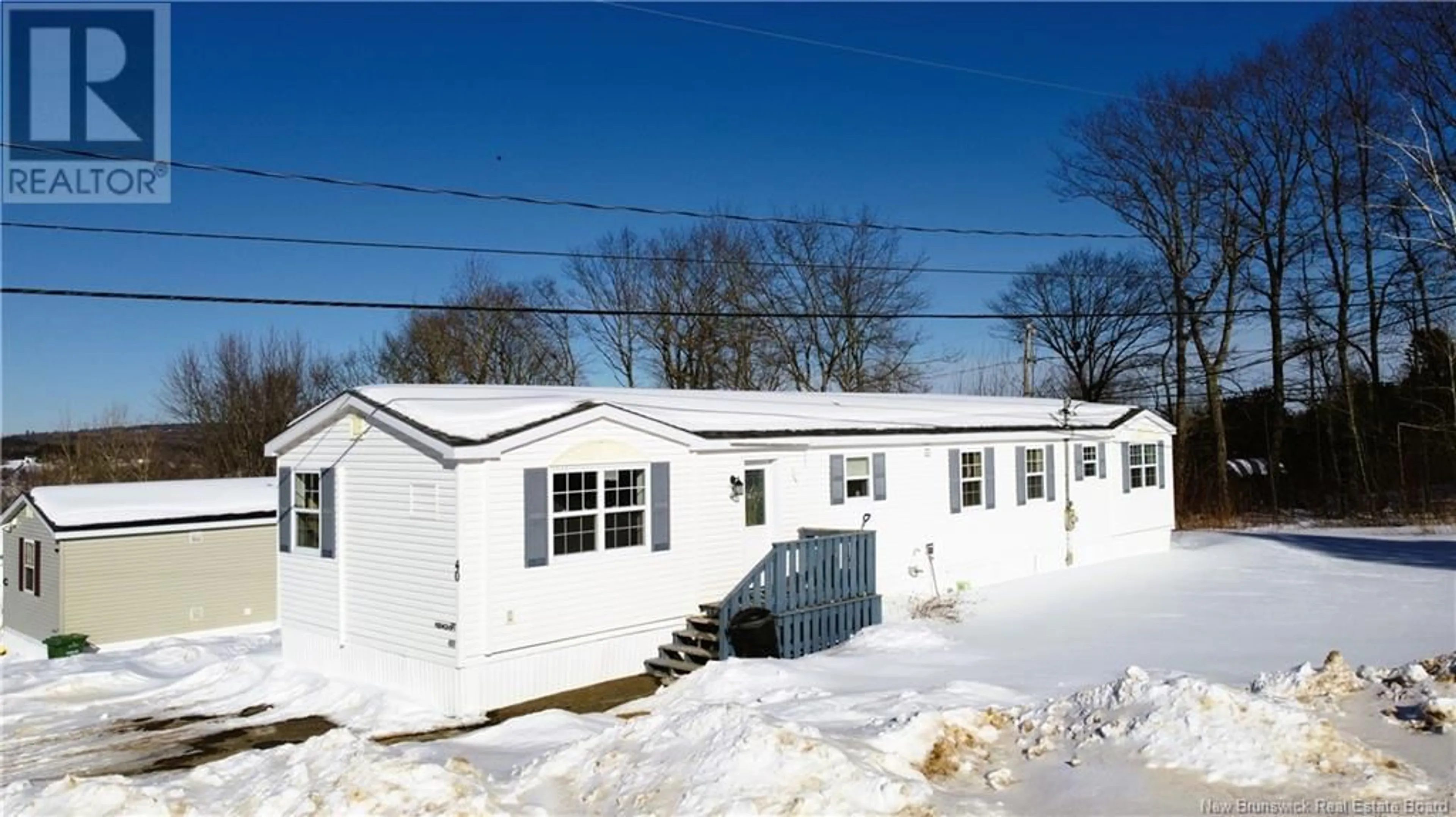 Home with vinyl exterior material, street for 40 MacIntosh Street, Fredericton New Brunswick E3C2M9