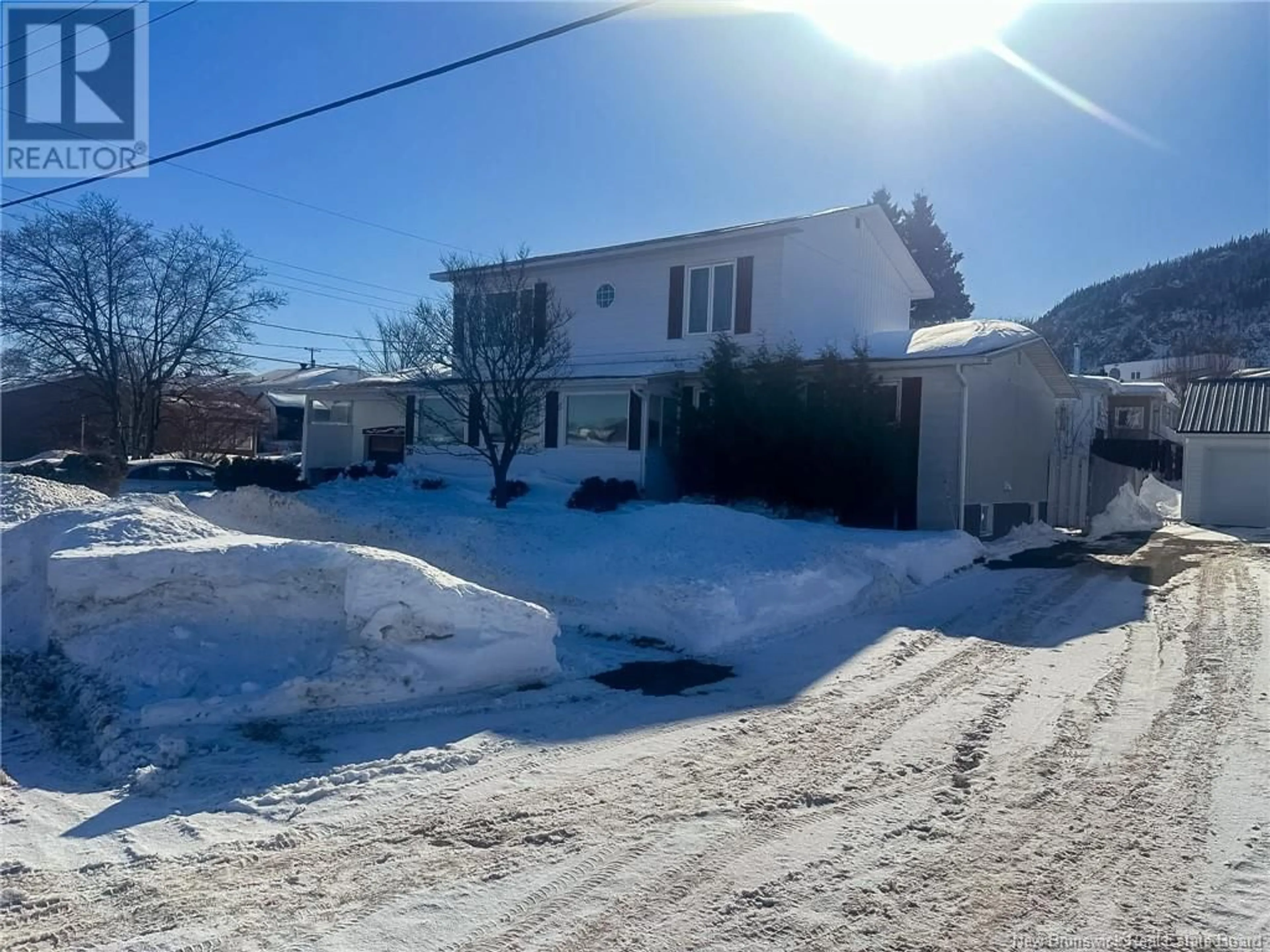 A pic from outside/outdoor area/front of a property/back of a property/a pic from drone, street for 20 Malcolm Avenue, Campbellton New Brunswick E3N3X1