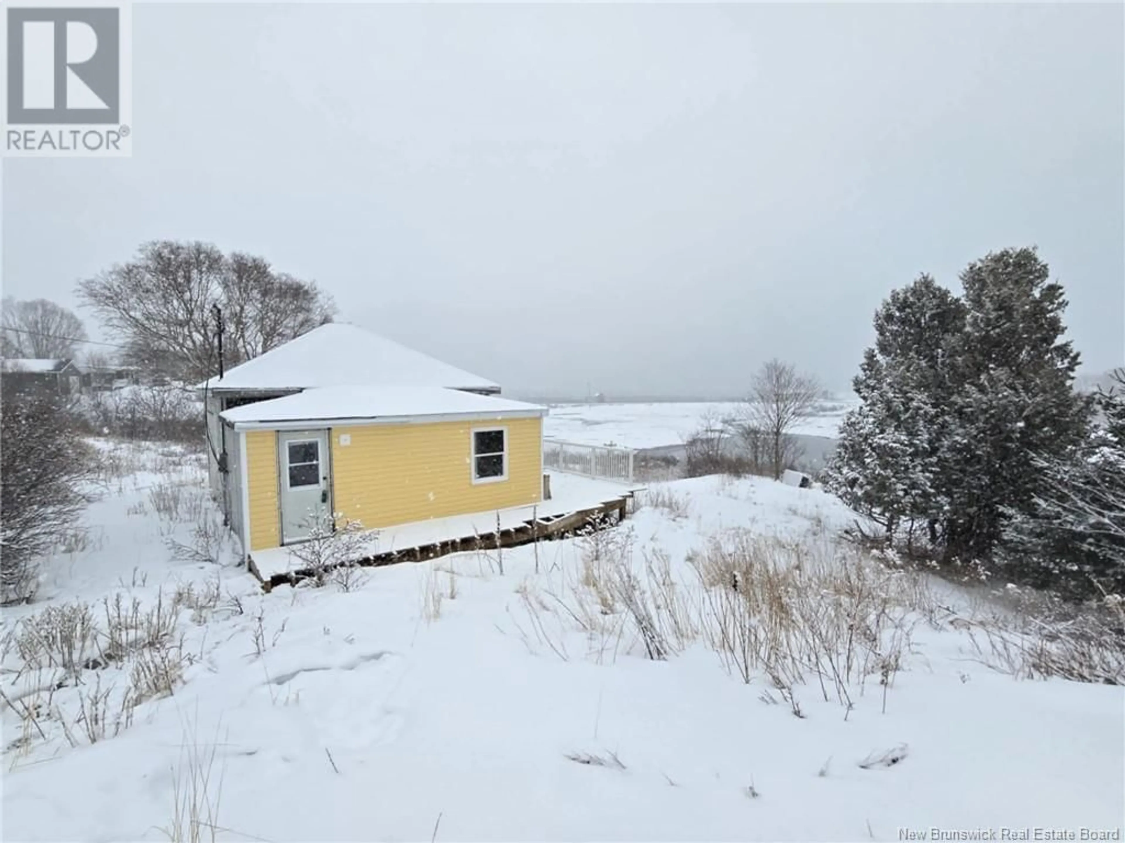 A pic from outside/outdoor area/front of a property/back of a property/a pic from drone, unknown for 15 Fundy View Drive, Back Bay New Brunswick E5C2X8